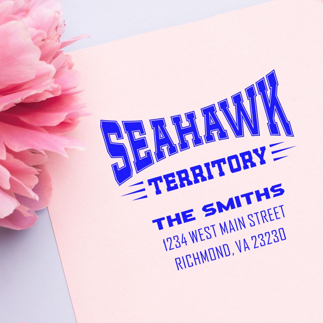Custom address rubber stamp with family name and Richmond, VA details for personalized mailing.