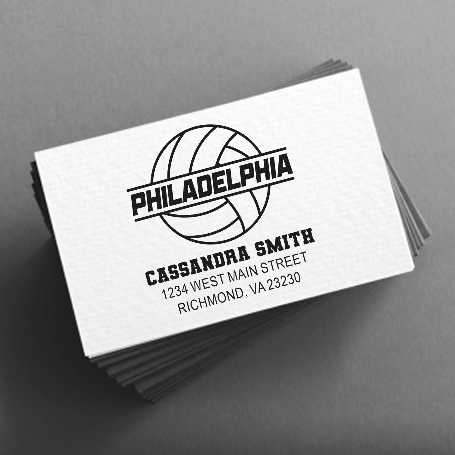 Custom rubber stamp with Philadelphia logo, name, and address for branding business cards, mailers, and packaging.