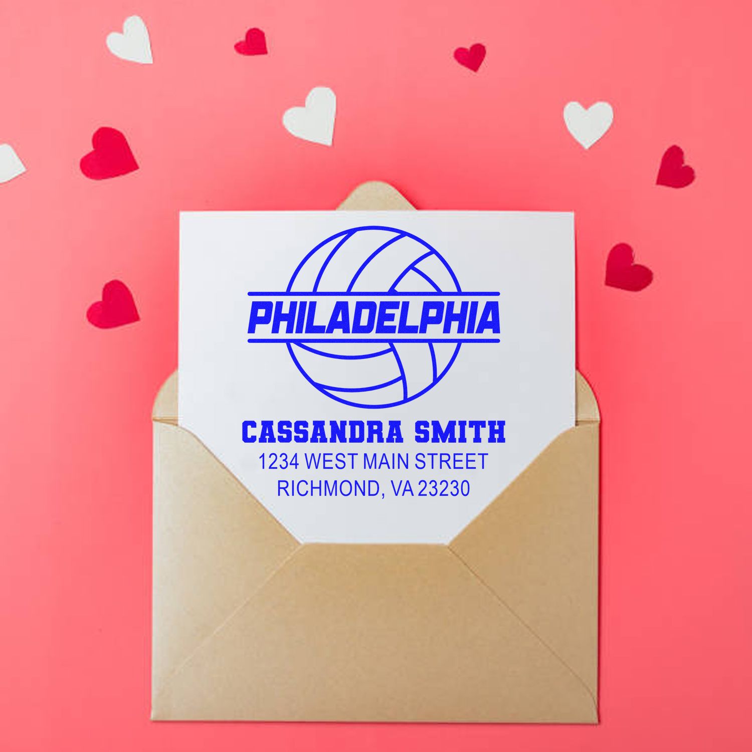 Custom rubber address stamp with Philadelphia volleyball design, name, and return address on an envelope.