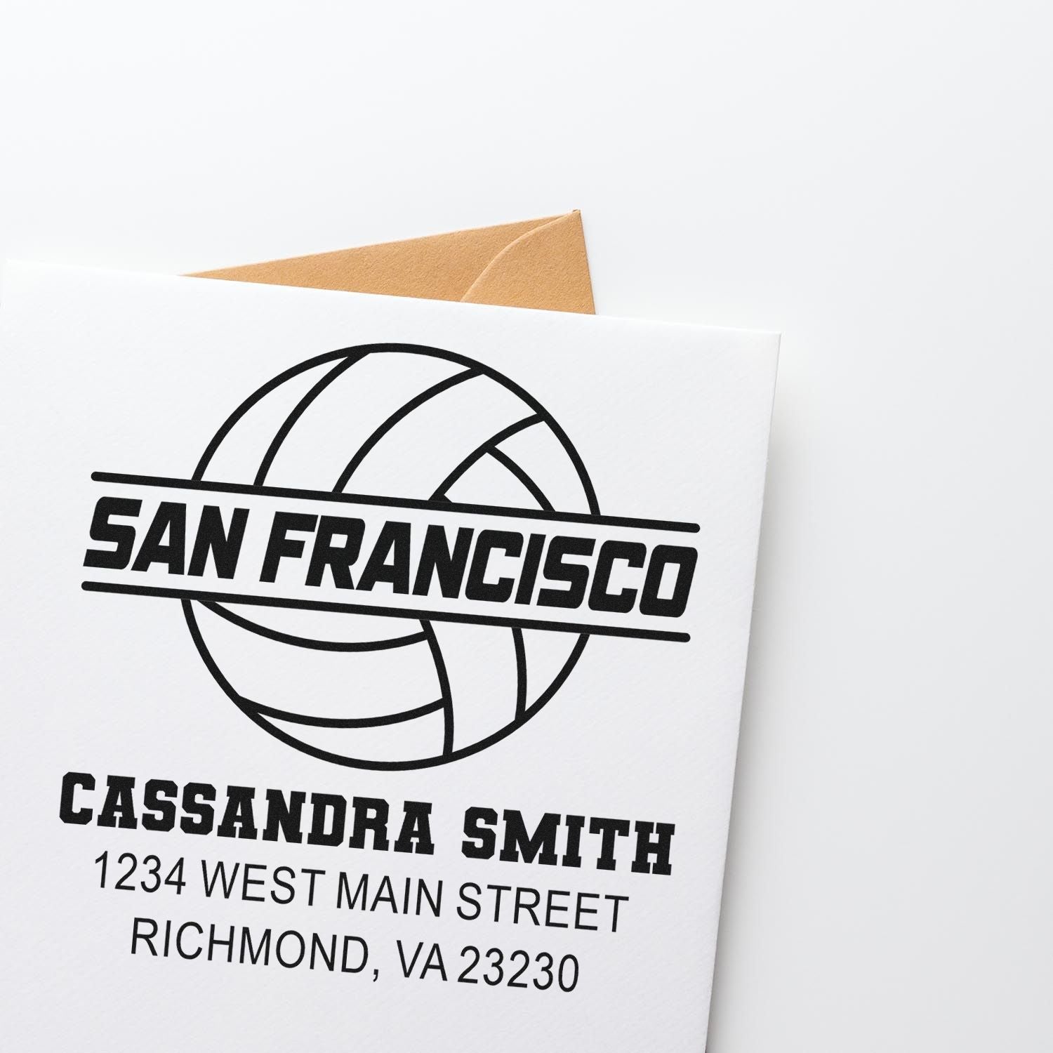 Custom return address rubber stamp with San Francisco design, personalized for Cassandra Smith, shown on a mailing envelope.