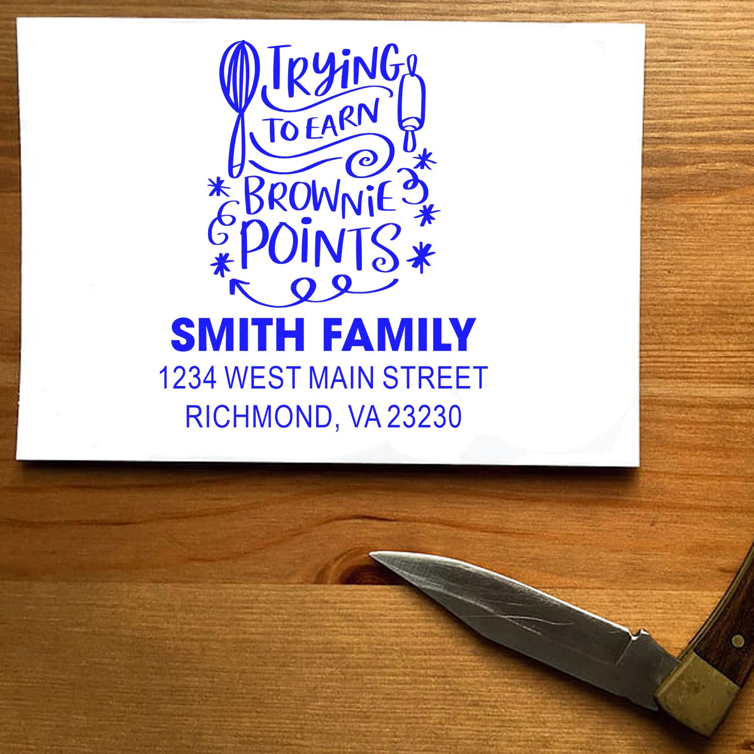 Custom rubber stamp design proof for Smith family address and Trying to Earn Brownie Points return mailing stamp.