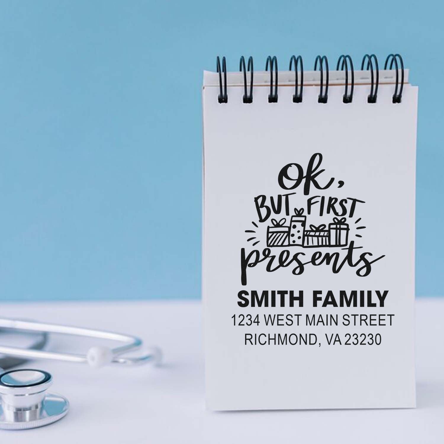 Custom rubber stamp with OK, but first presents design, Smith family name, and address for holiday gift packaging.