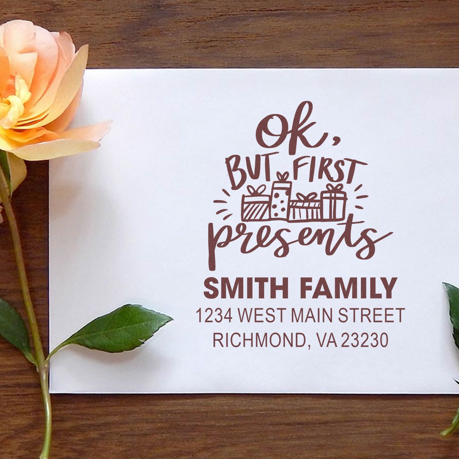 Custom holiday rubber stamp with Ok, but first presents and return address for festive cards and gift packaging.