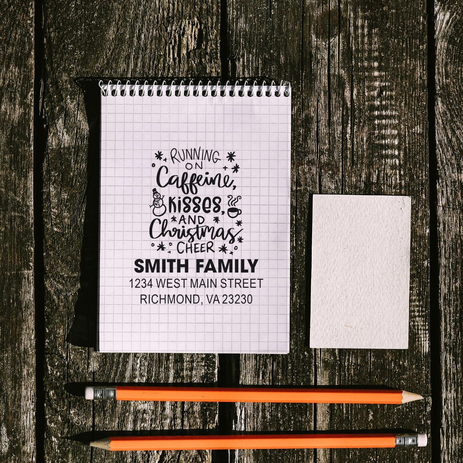 Custom rubber stamp proof with festive Christmas return address and Running on caffeine, kisses, and Christmas cheer family design.