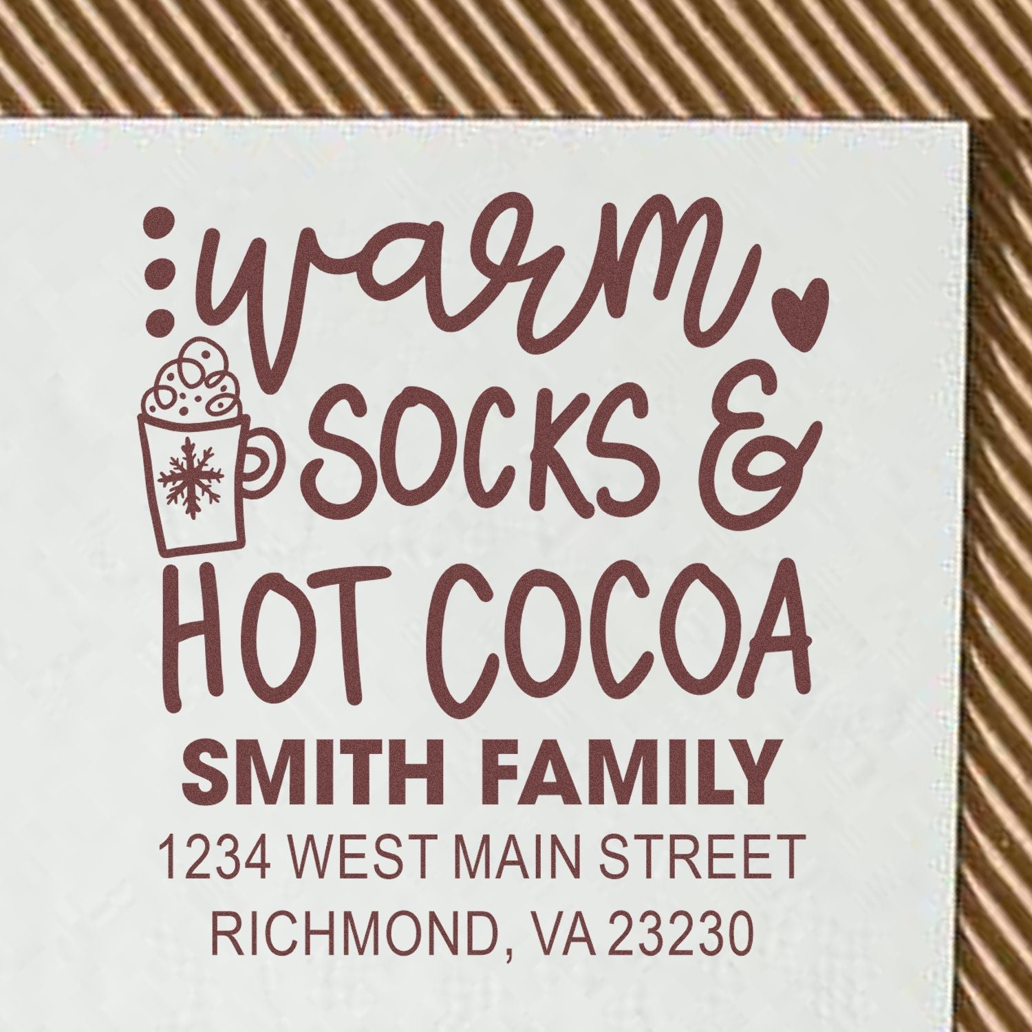 Custom rubber stamp design reading warm socks & hot cocoa for Smith Family, with address, perfect for holiday cards and gifts.
