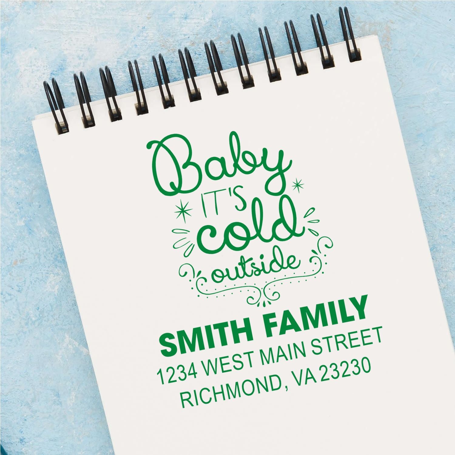 Personalized rubber stamp mockup with Baby its cold outside and custom Smith Family return address.