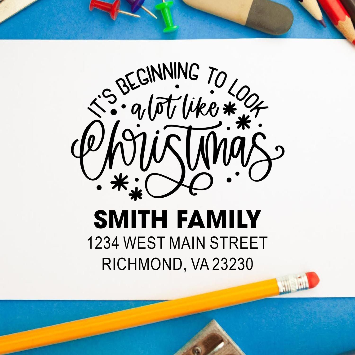 Personalized Christmas return address rubber stamp with It's Beginning to Look a Lot Like Christmas and Smith family address.
