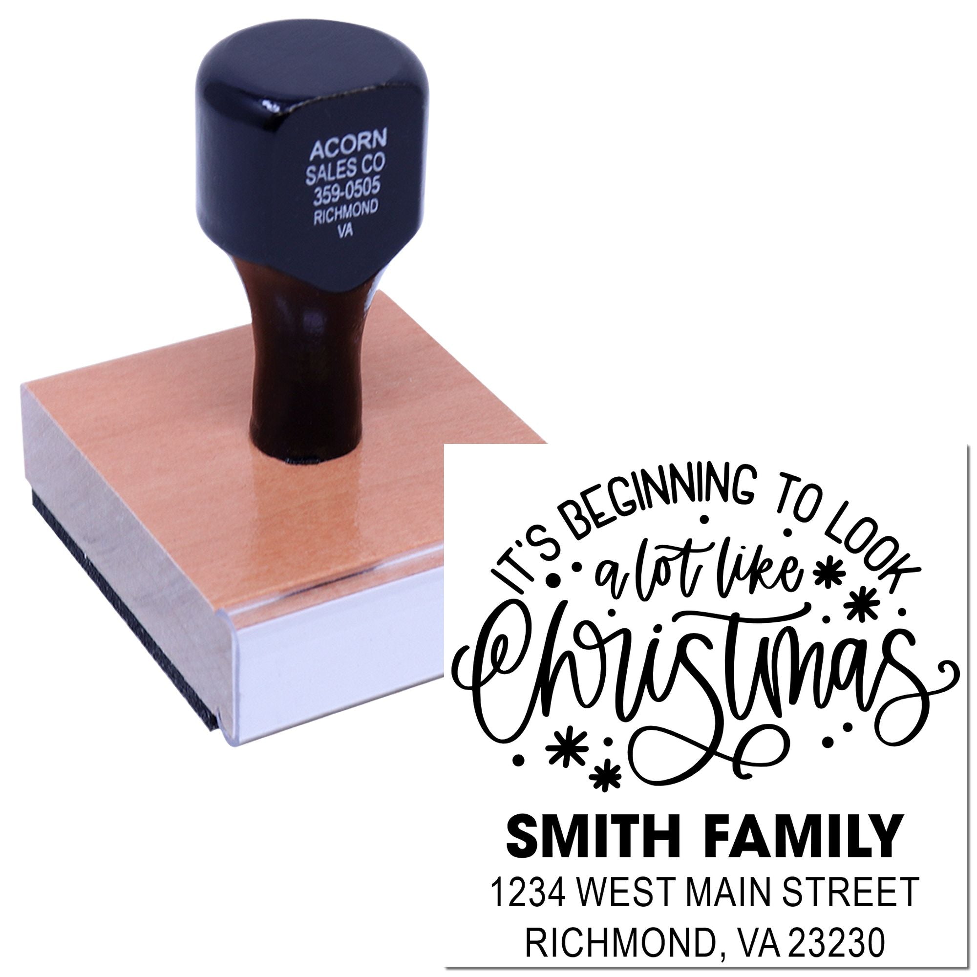Custom Christmas address rubber stamp with family name, return address, and holiday lettering on a wooden stamp block.