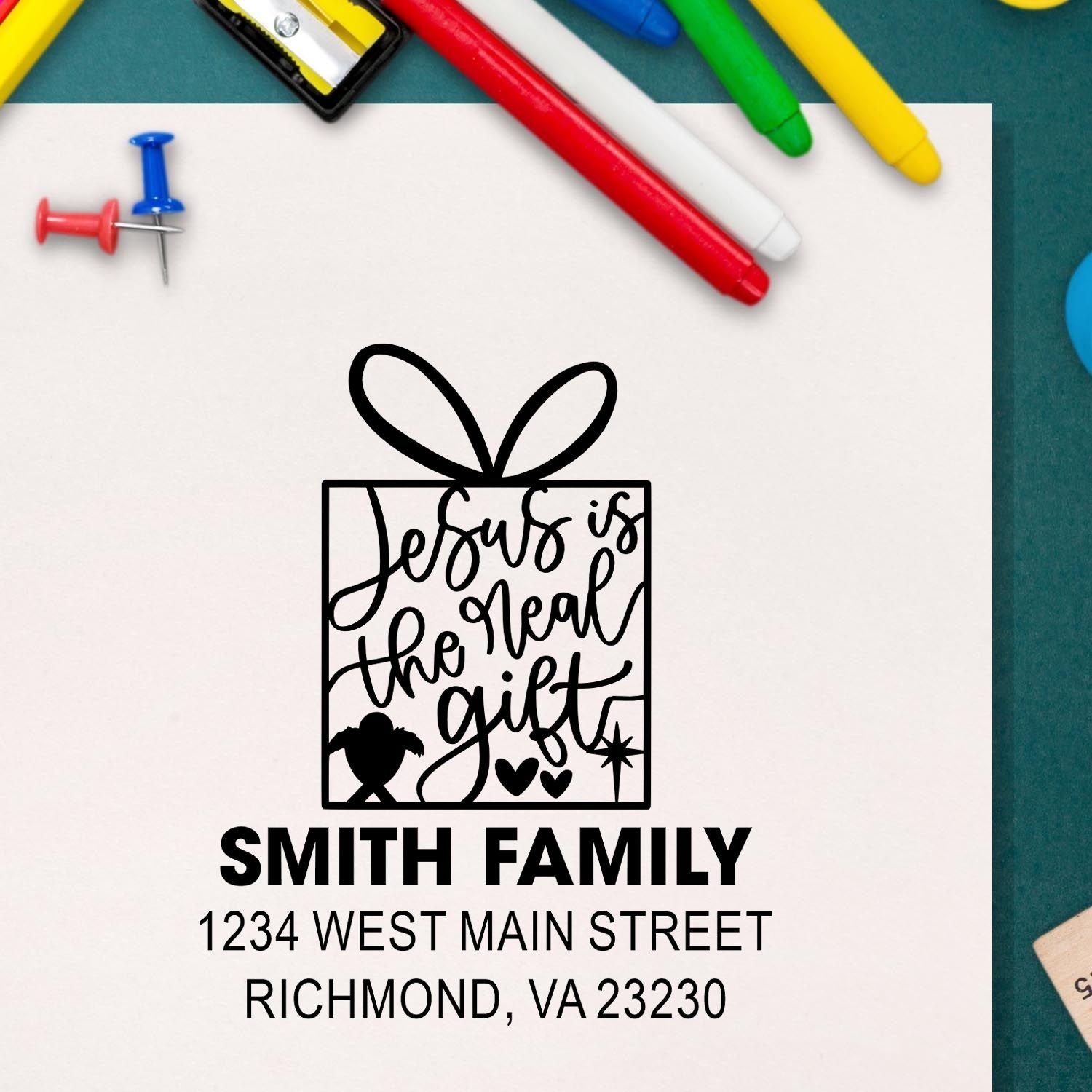 Custom rubber stamp with Jesus is the real gift gift-box design and Smith family return address, Richmond VA 23230.