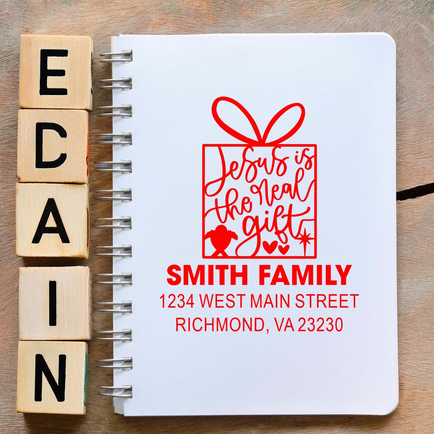 Custom Christmas address rubber stamp design with gift box art, Jesus is the real gift, and Smith Family Richmond, VA details.