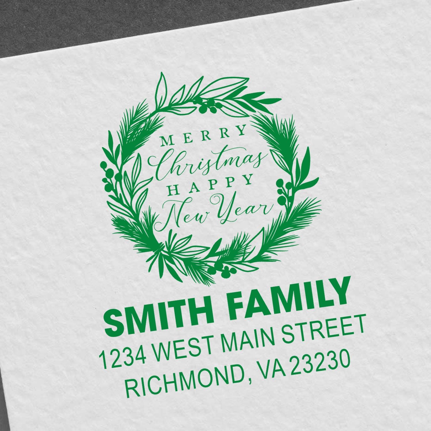 Custom Merry Christmas and Happy New Year rubber stamp with wreath, Smith family name, and return address.