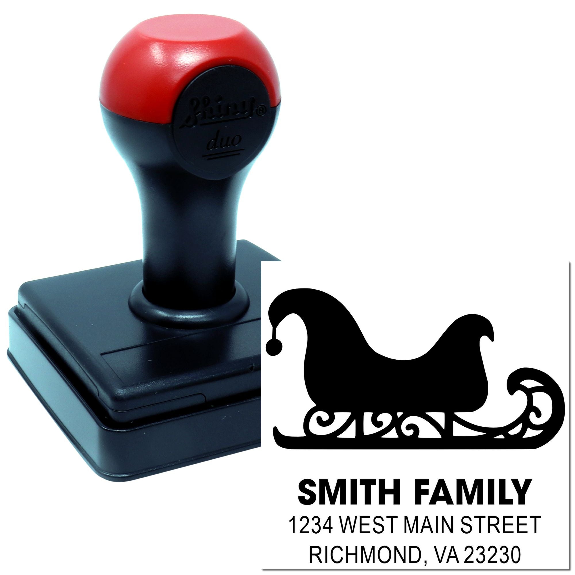 Custom self-inking rubber address stamp with sleigh design, family name, and mailing address for holiday cards and mail.
