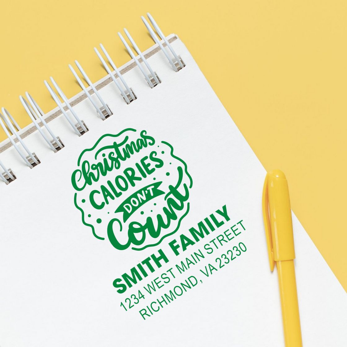 Custom rubber stamp on notebook featuring Christmas calories dont count and Smith family return address.