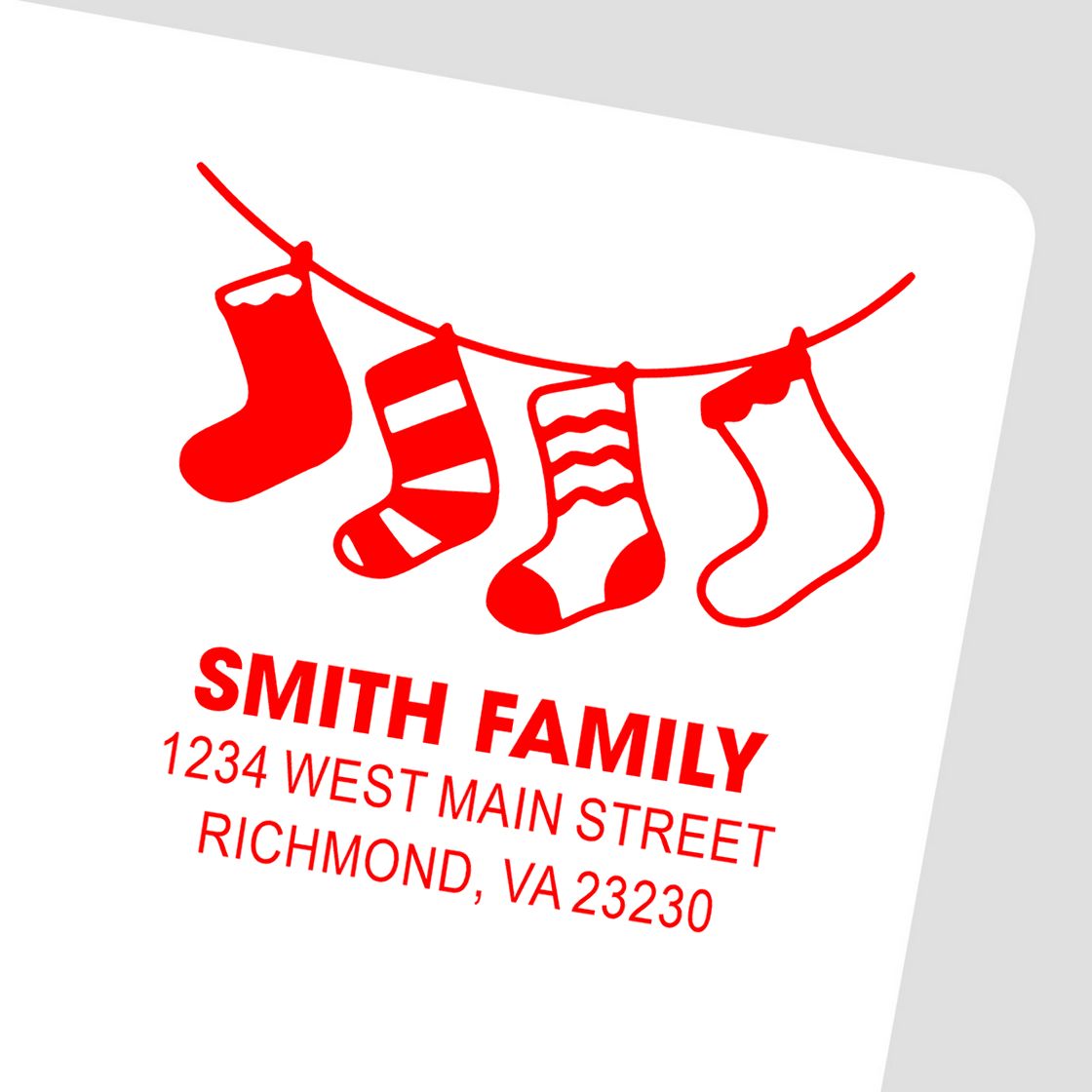 Custom Christmas return address rubber stamp with hanging stockings for Smith Family, 1234 West Main Street, Richmond, VA 23230.