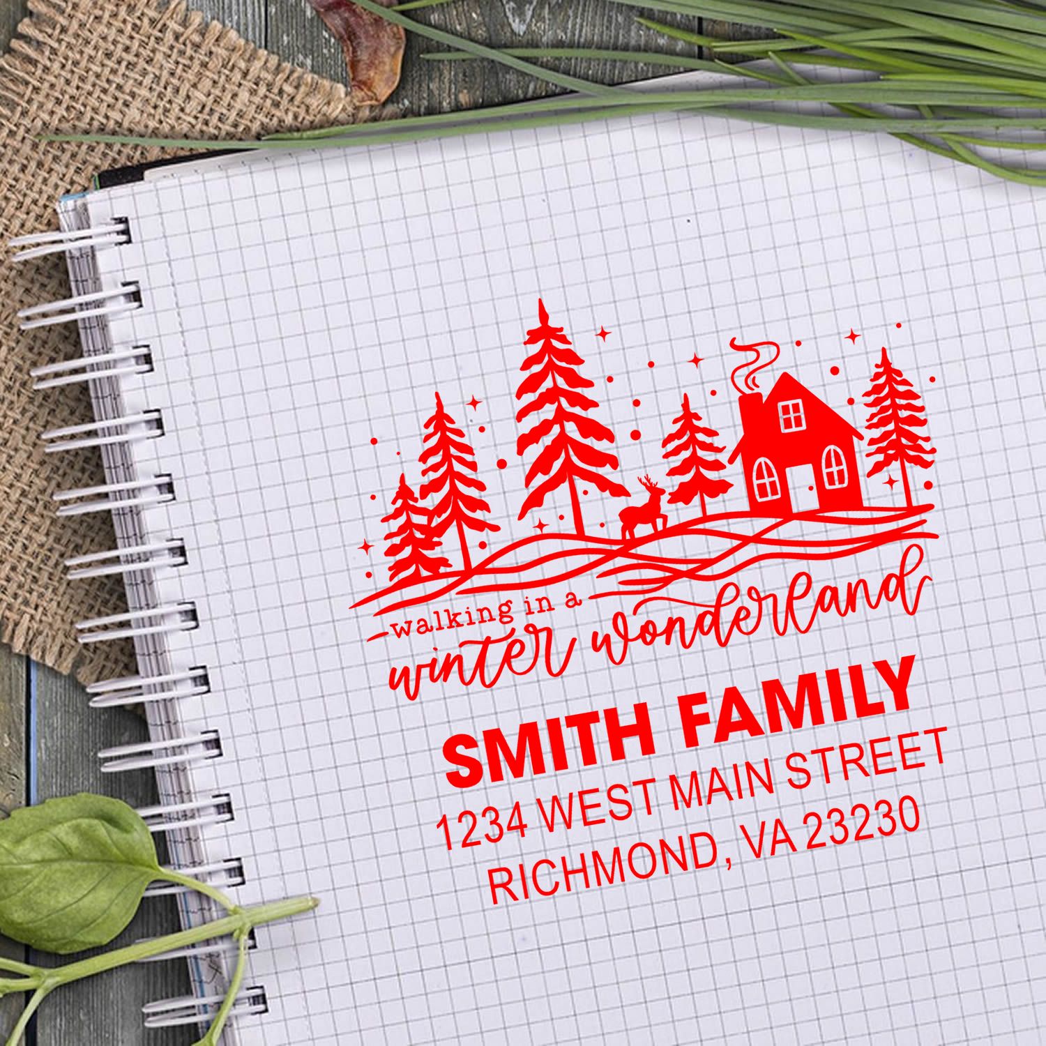 Personalized winter wonderland address rubber stamp with family name, house, trees and deer for holiday stationery.