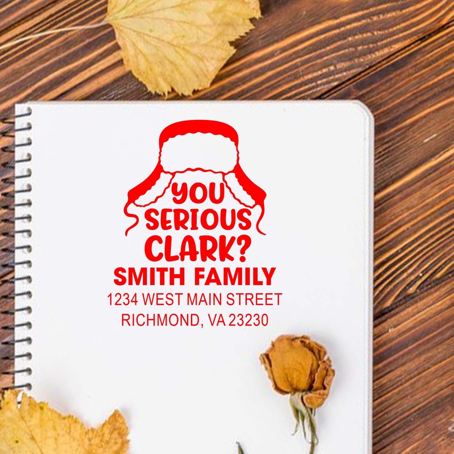 Personalized rubber stamp design with You Serious Clark? quote, Smith family name, and Richmond, VA address on notebook.