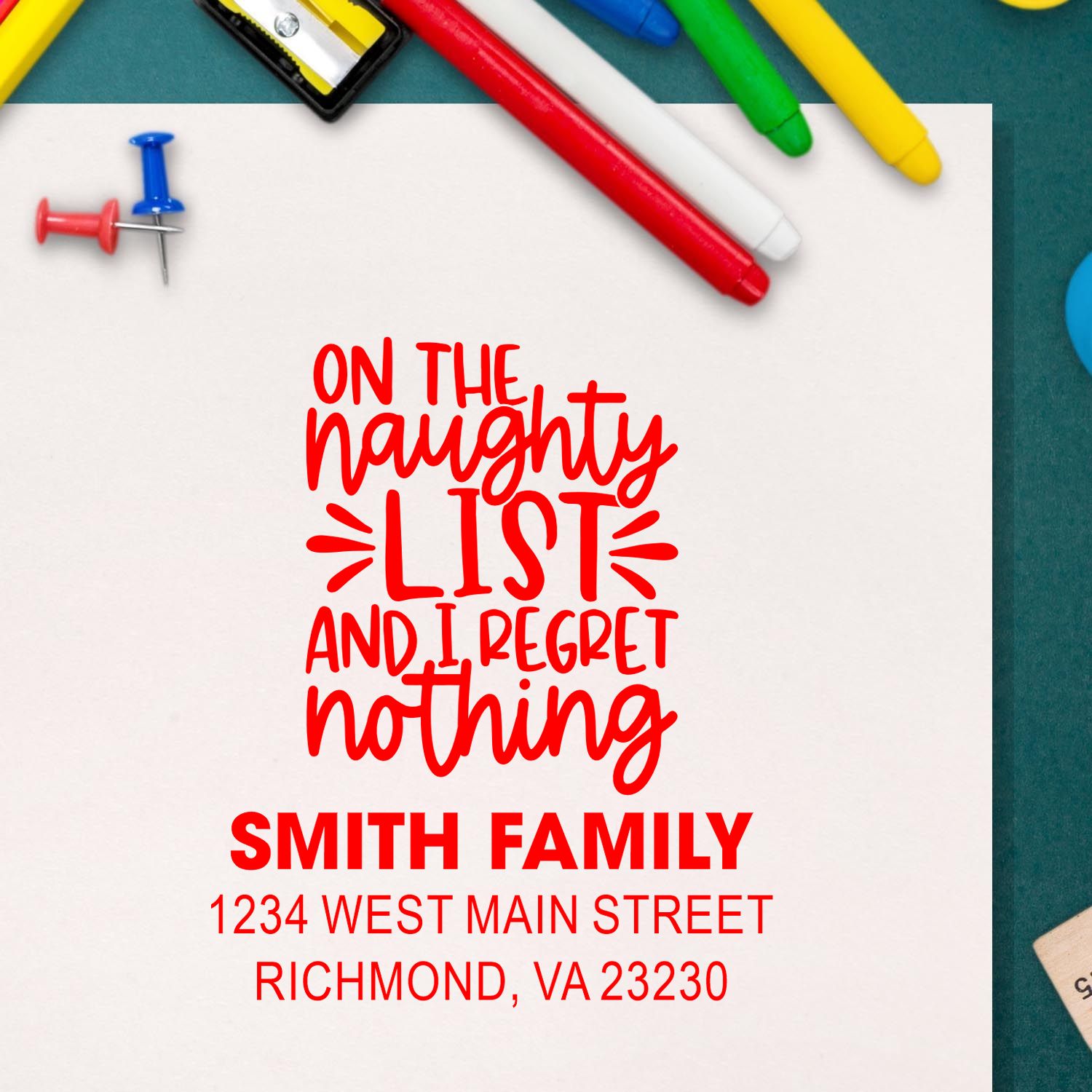 Custom rubber address stamp with On the Naughty List and I Regret Nothing holiday message for the Smith Family.