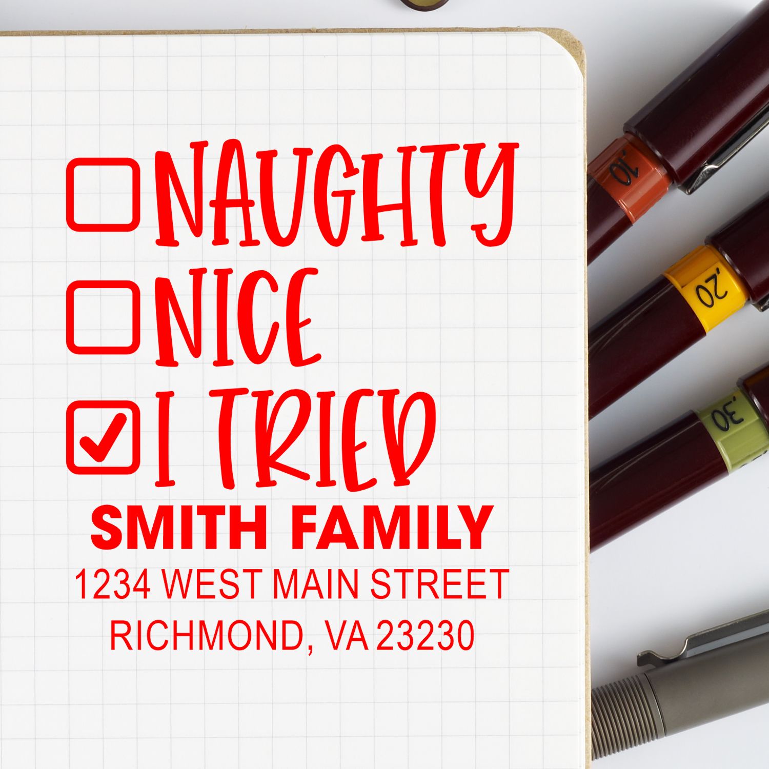 Custom rubber stamp design with naughty, nice and tried checkboxes, plus Smith family address for holiday mailing.