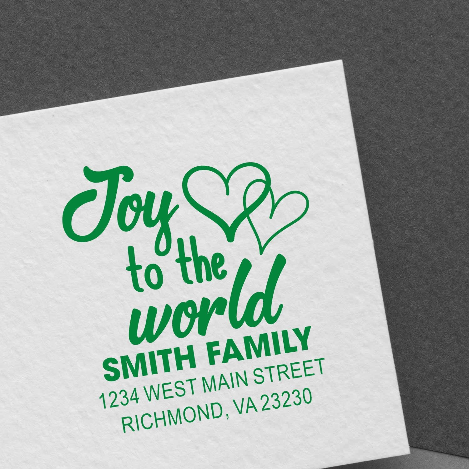 Personalized Christmas rubber stamp with Joy to the World, family name, and address for holiday cards.