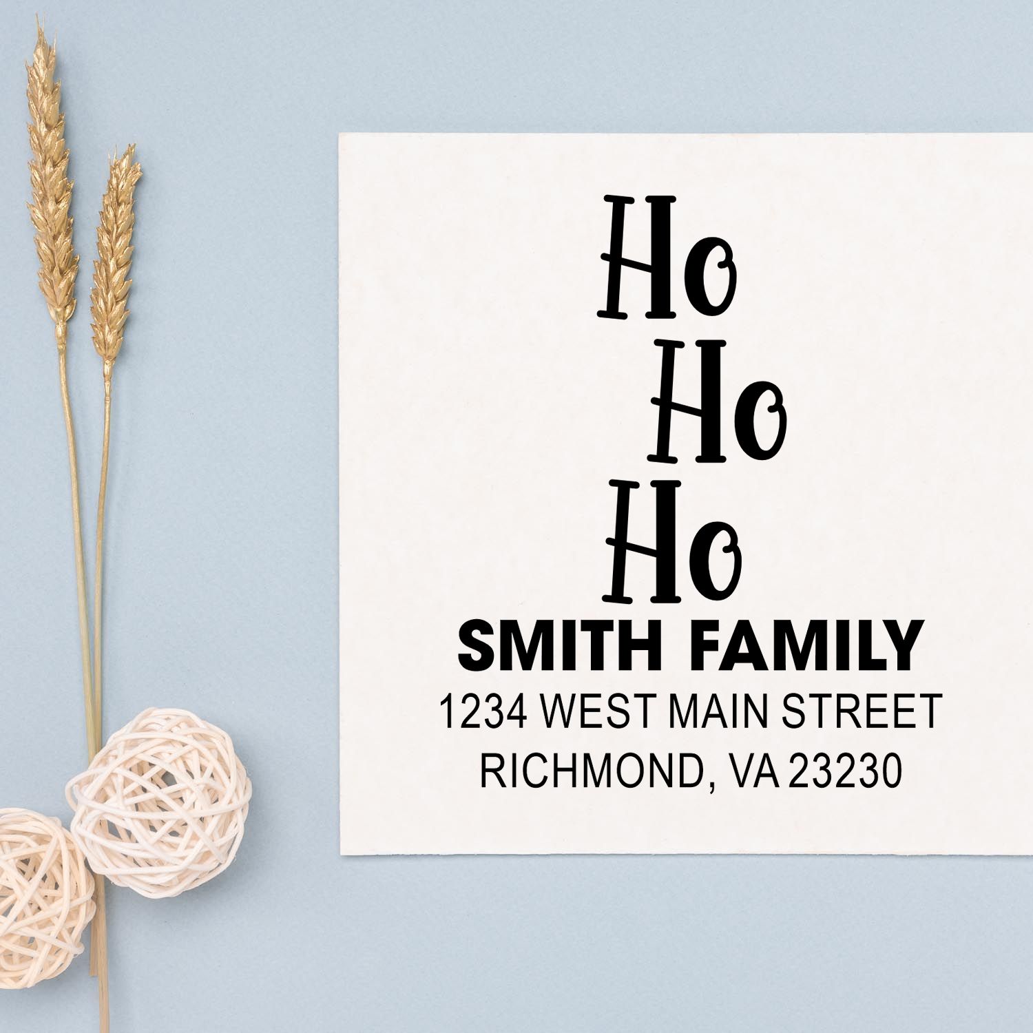 Custom Ho Ho Ho rubber stamp with Smith Family return address for holiday cards and festive envelopes.