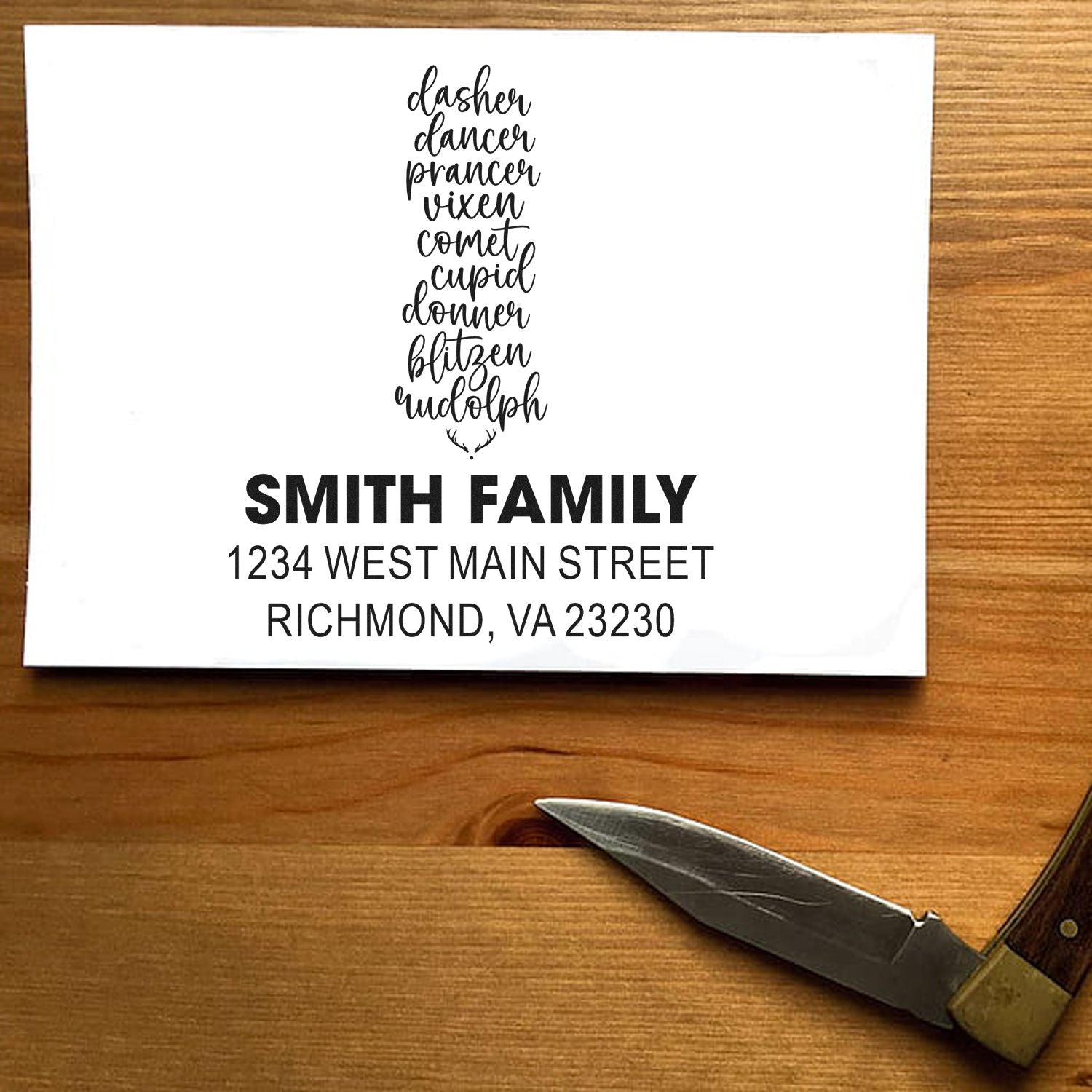 Custom rubber return address stamp with Christmas reindeer names, Smith Family, and address for holiday mailing