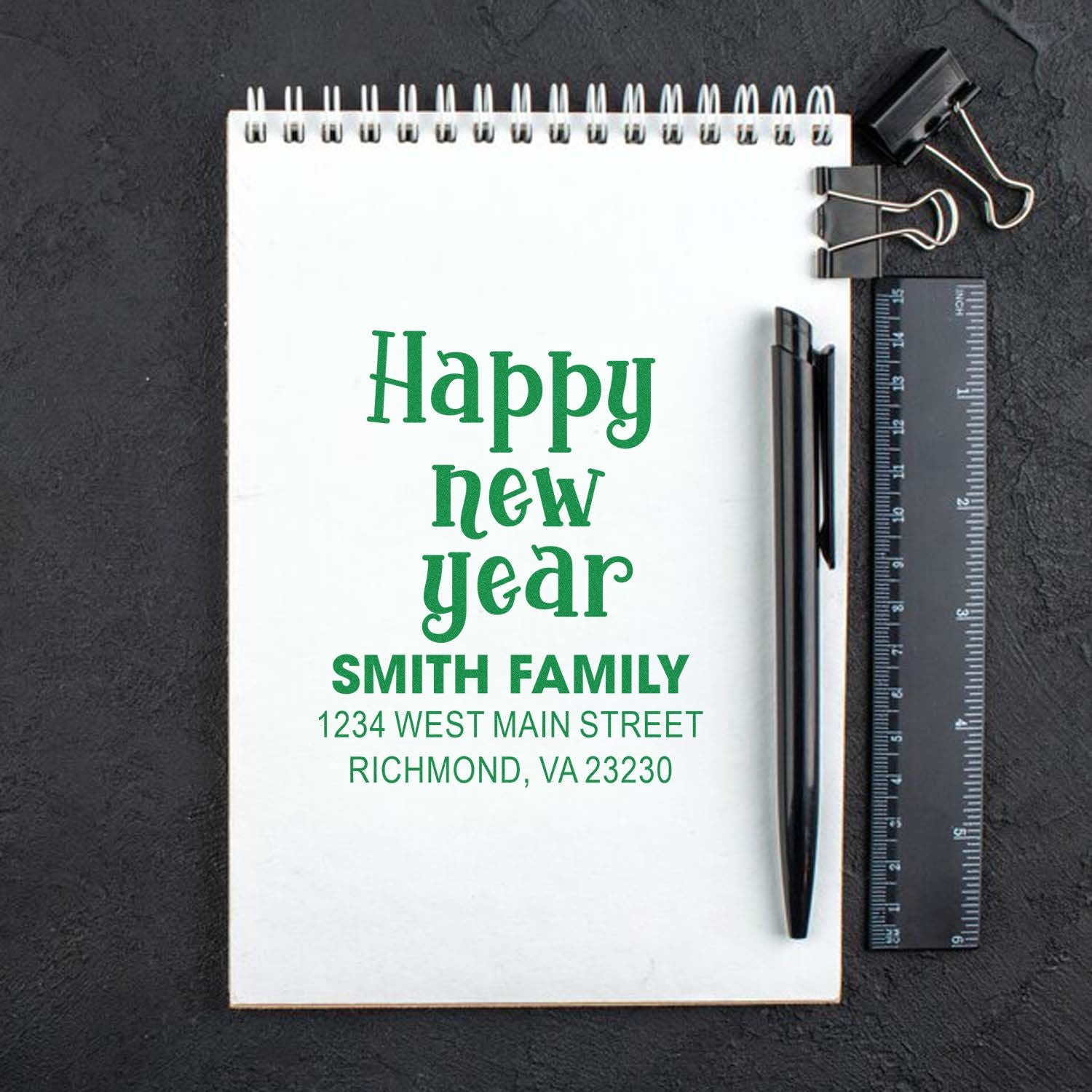 Custom Happy New Year address rubber stamp mockup for Smith family holiday cards and stationery.