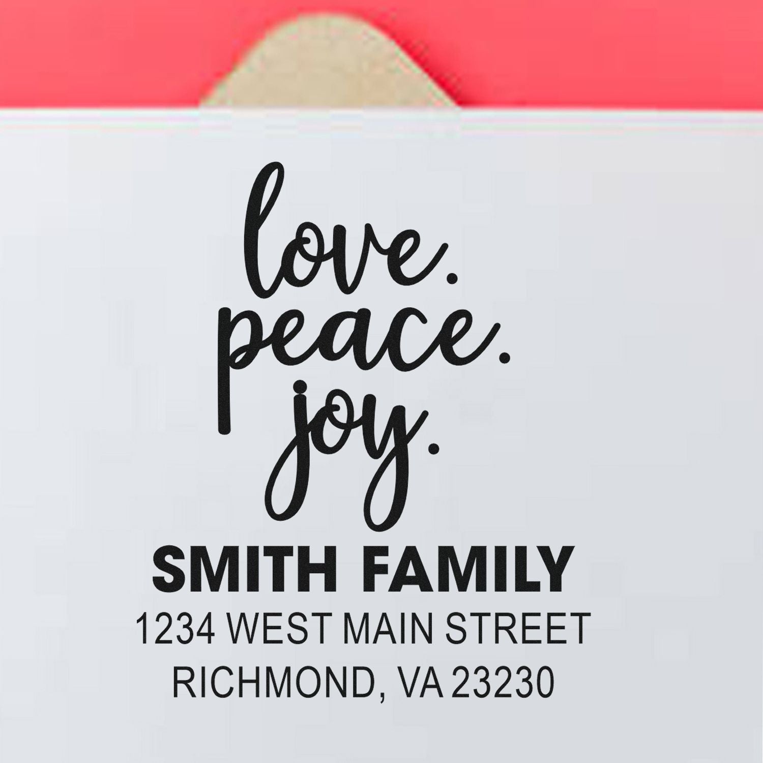 Personalized custom rubber stamp with love, peace, joy and Smith family return address for mailing and packaging.