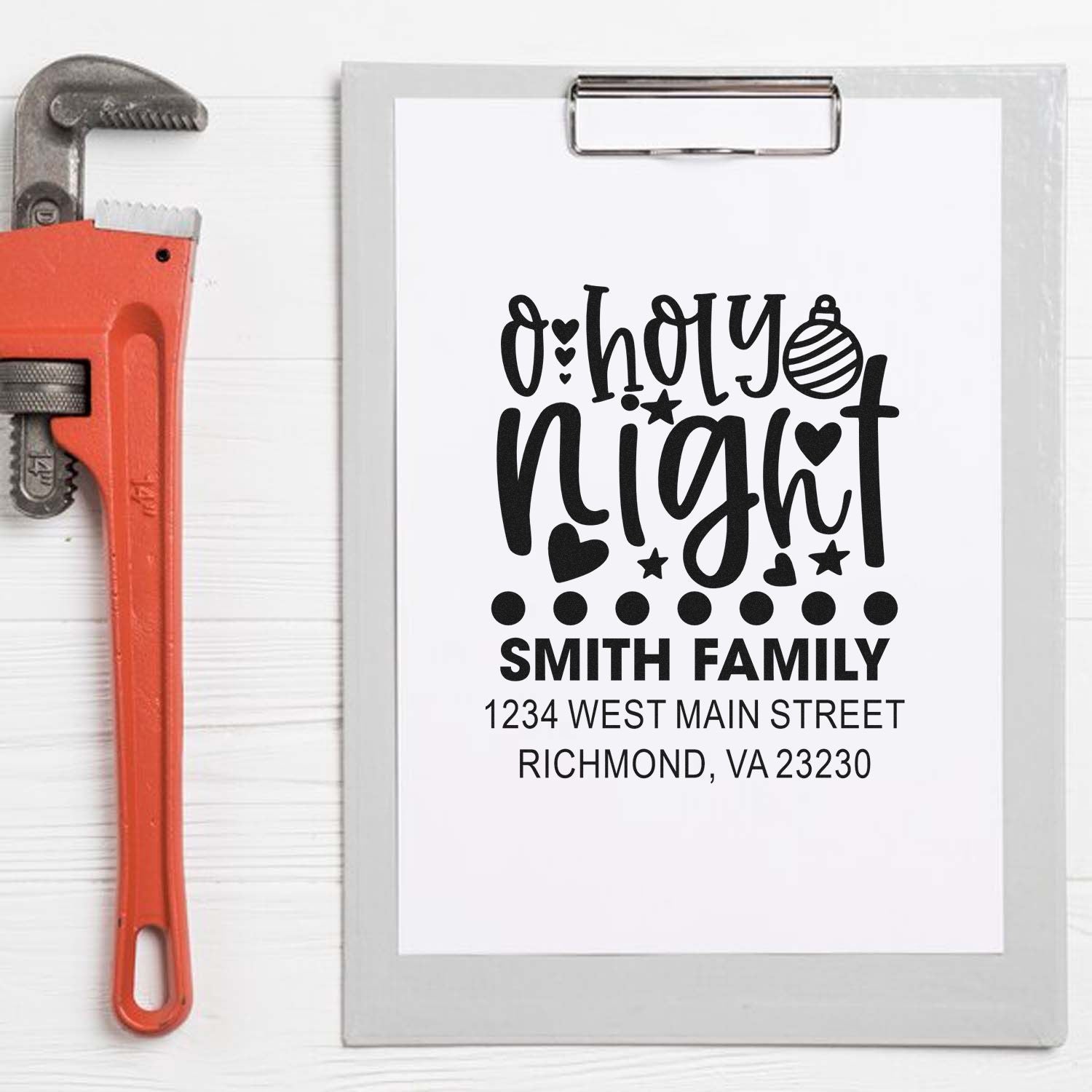 Custom rubber stamp design for holiday mailers with Oh Holy Night, Smith family name, and return address.