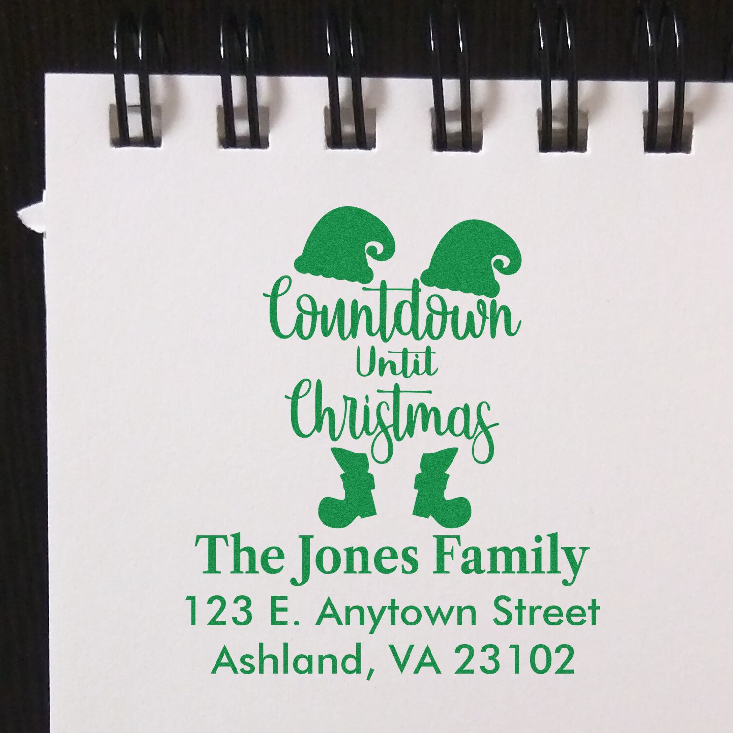 Custom Christmas countdown rubber stamp with family name and address for holiday cards and stationery.