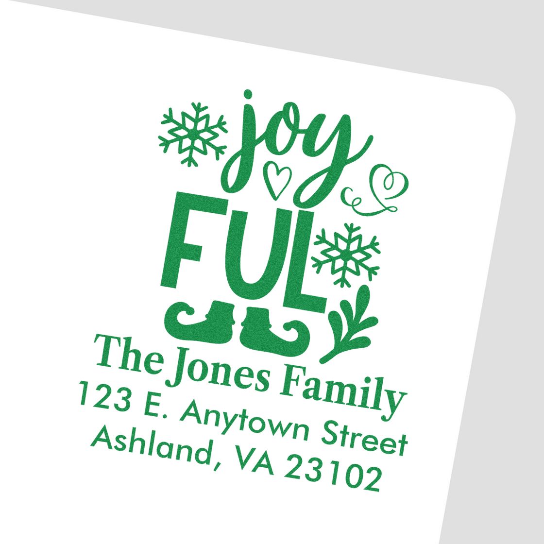 Custom holiday return address rubber stamp for The Jones Family, with Joyful Christmas design and address.
