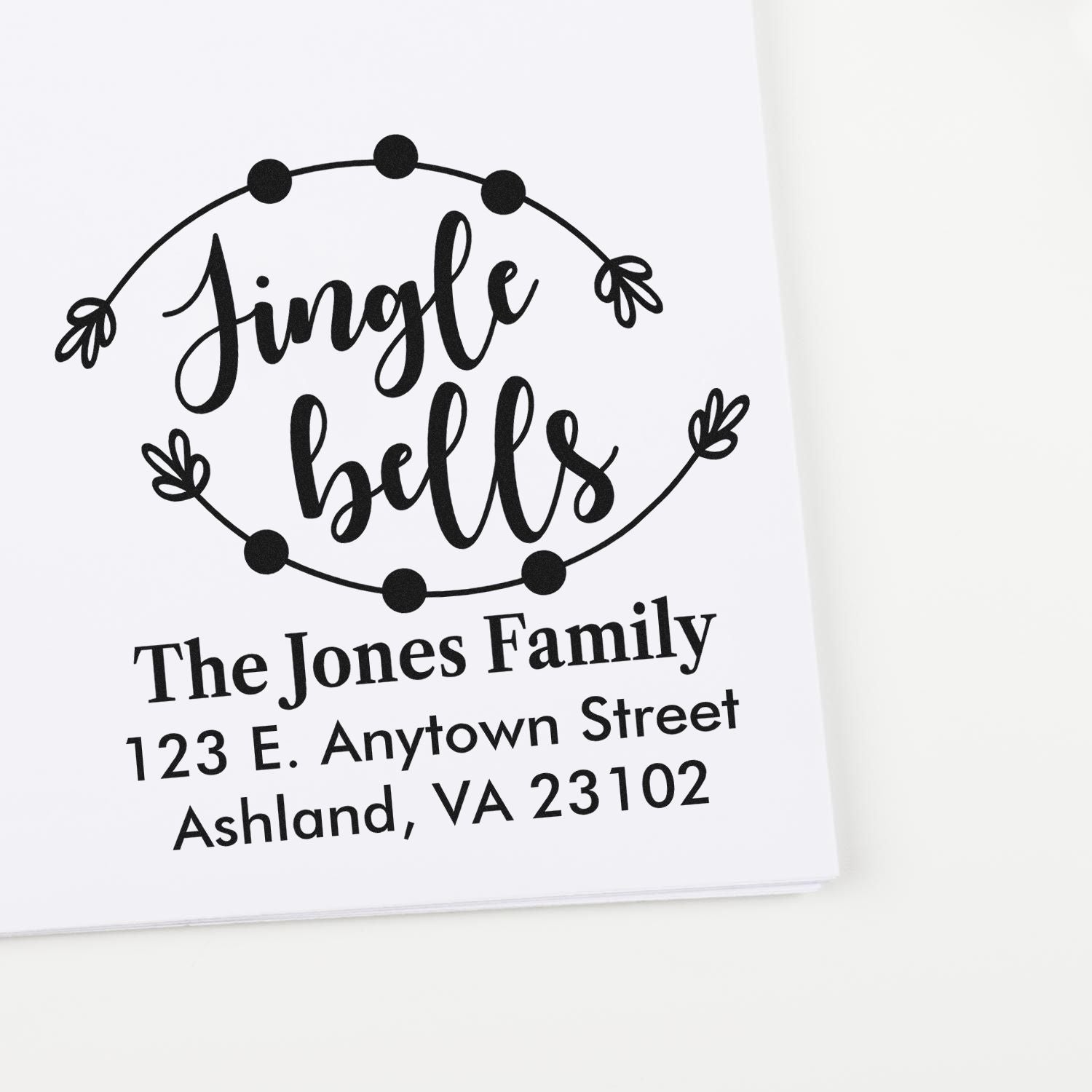 Personalized holiday return address rubber stamp with Jingle Bells design for The Jones Family.