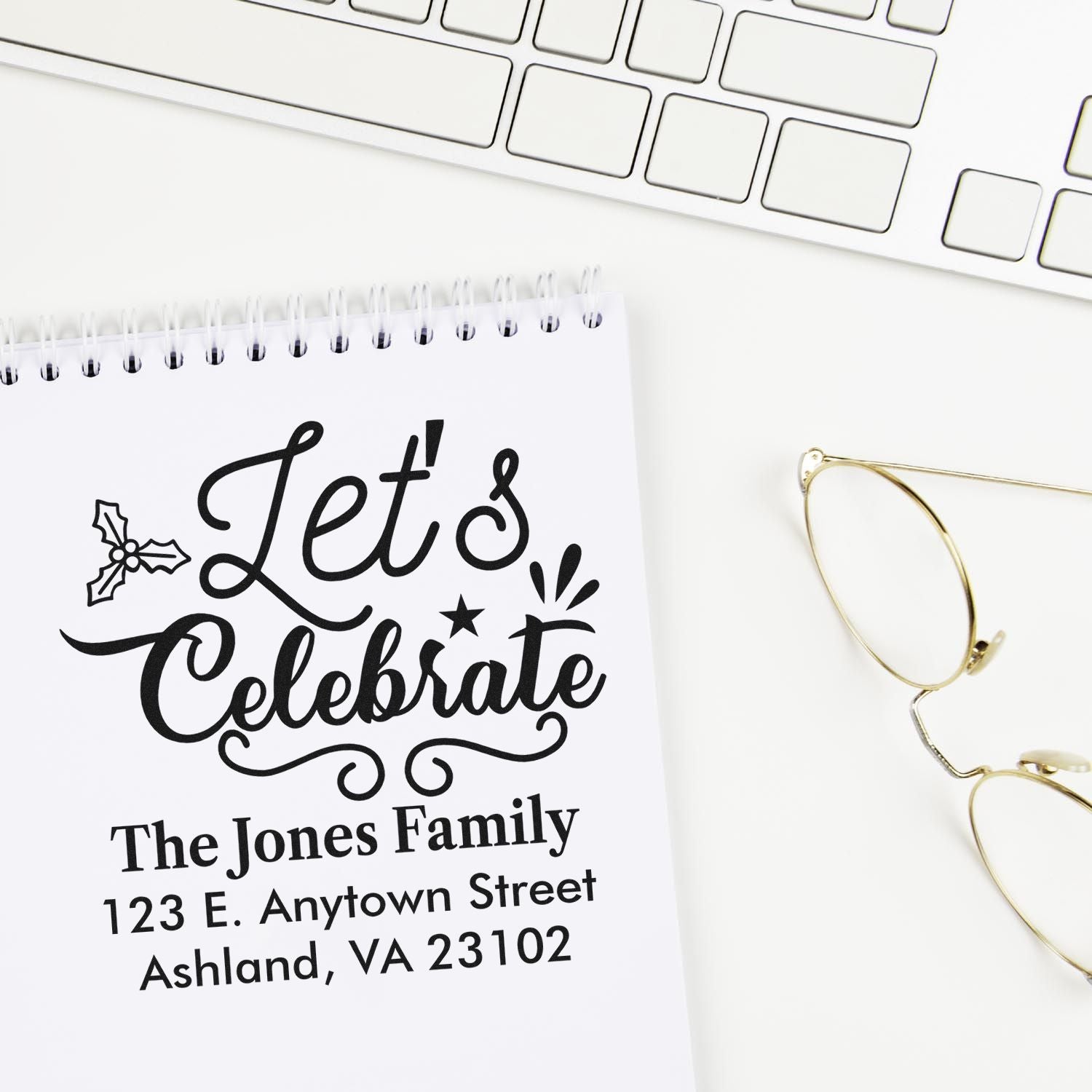 Personalized custom address rubber stamp with Lets Celebrate, family name, and mailing address for holiday cards.