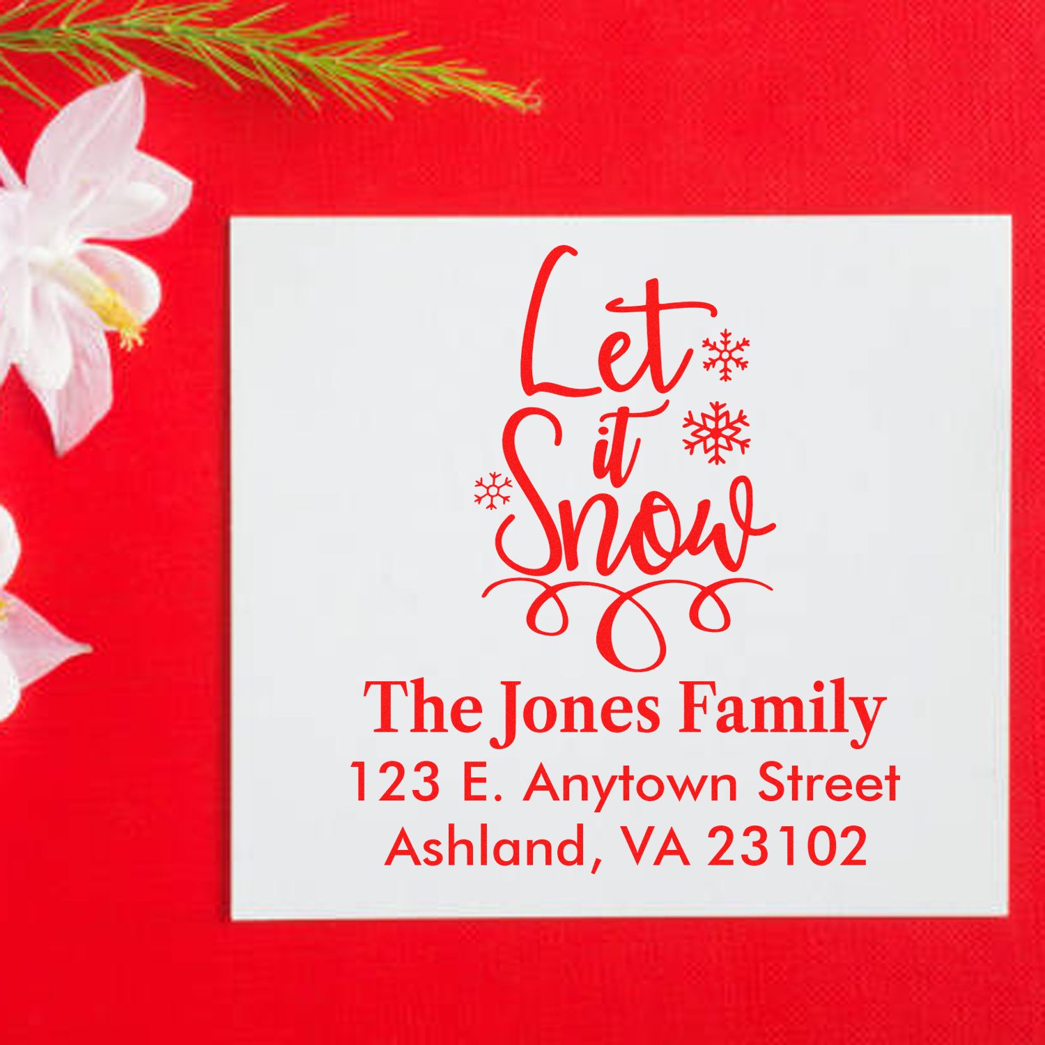 Personalized Let It Snow holiday return address stamp for Christmas cards, with family name and mailing address.