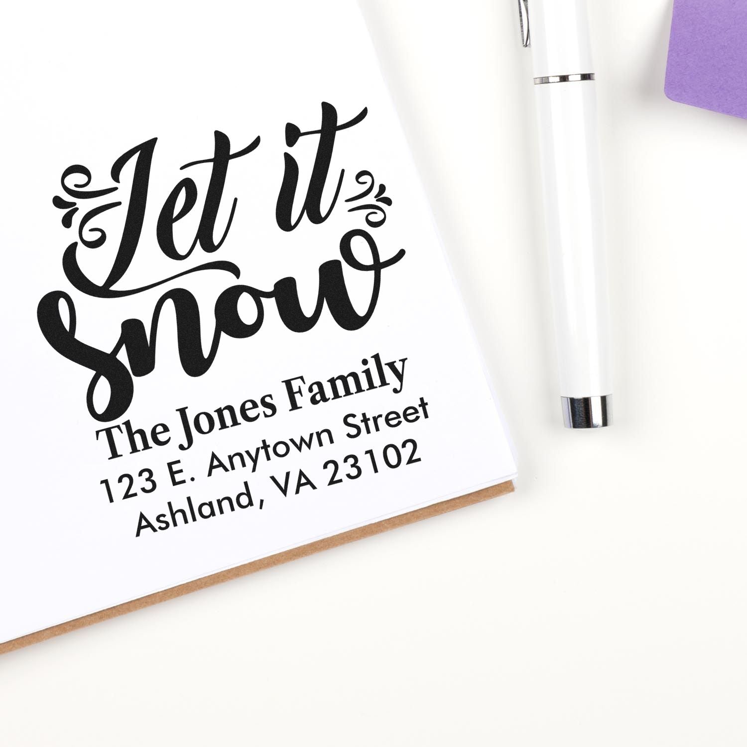 Personalized holiday rubber stamp with Let it snow design and family return address for festive cards and envelopes.