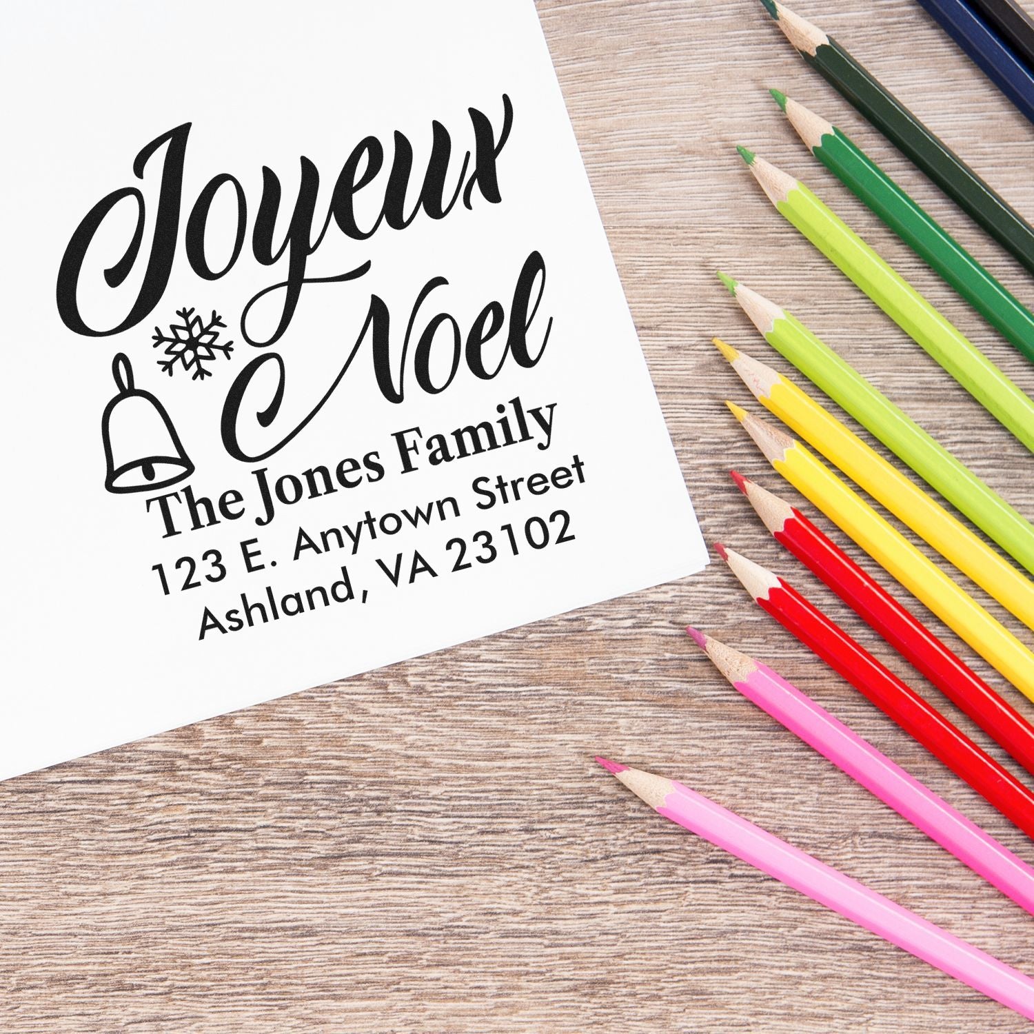 Personalized Christmas return address rubber stamp with Joyeux Noel, family name, and address for holiday cards.