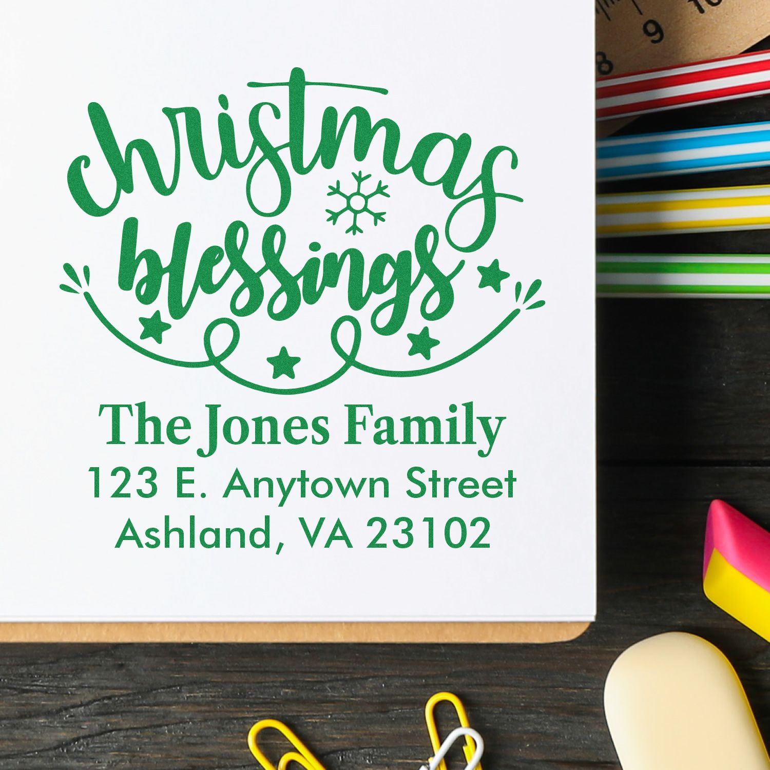 Custom Christmas rubber stamp with Christmas blessings and personalized family return address for holiday cards.