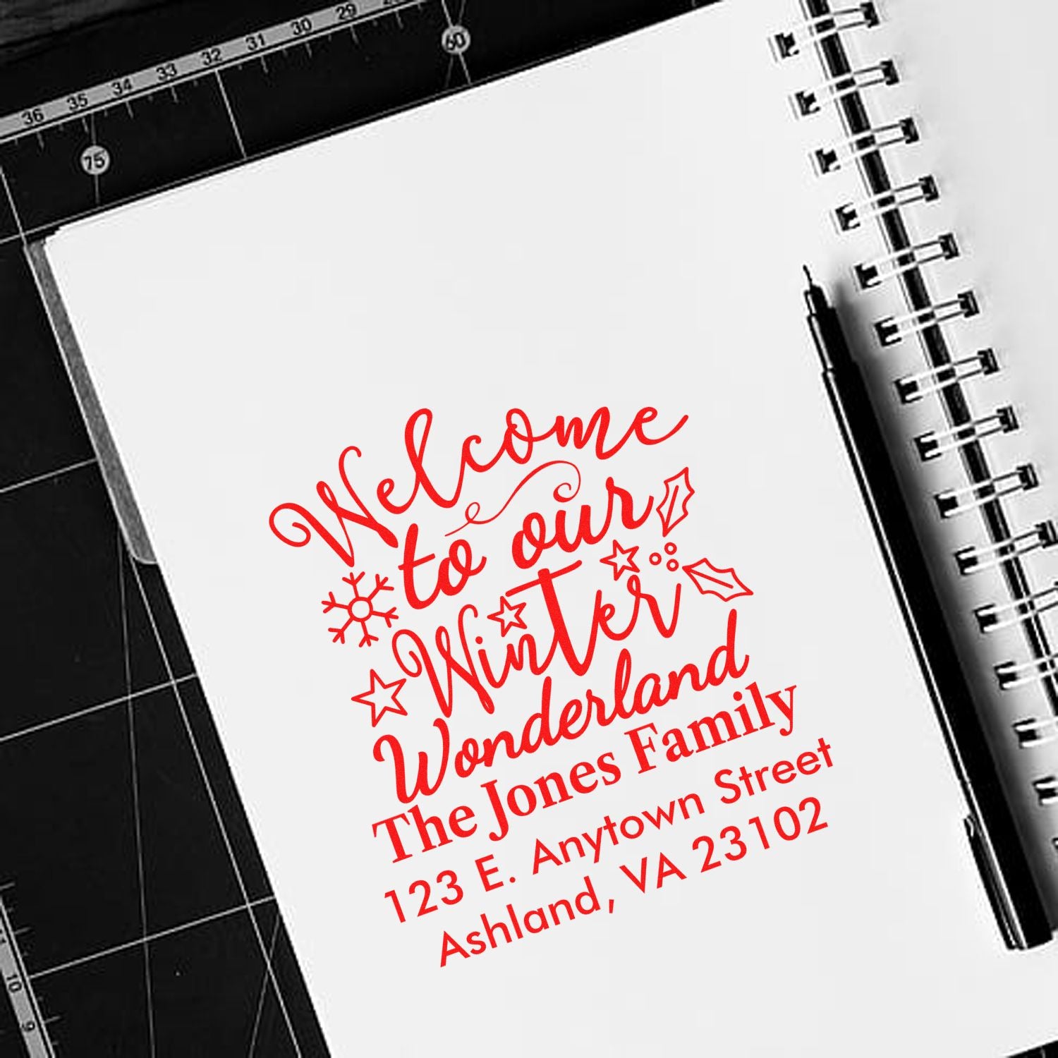 Personalized holiday rubber stamp reading Welcome to our Winter Wonderland with family name and address for festive mailings.