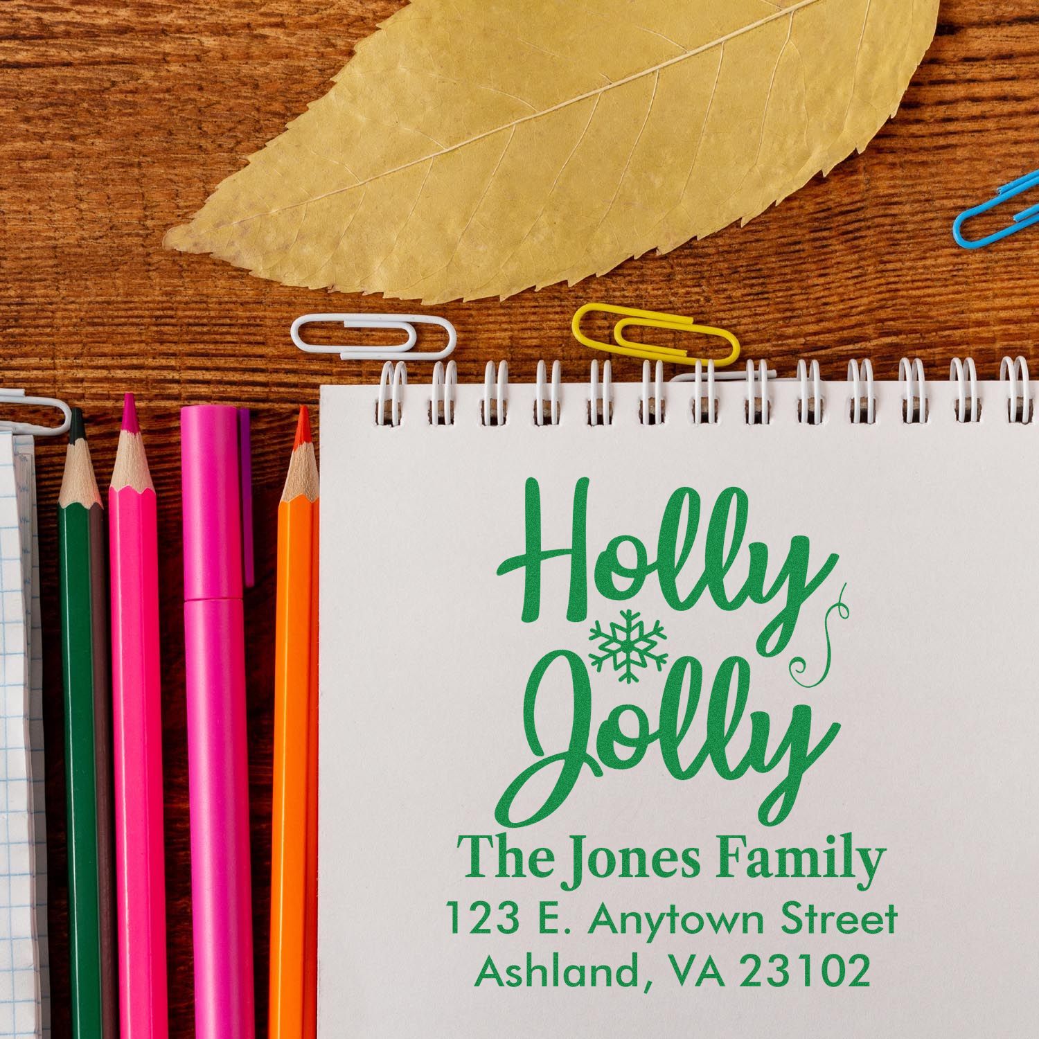 Personalized holiday return address rubber stamp with Holly Jolly design for The Jones Family Christmas cards.