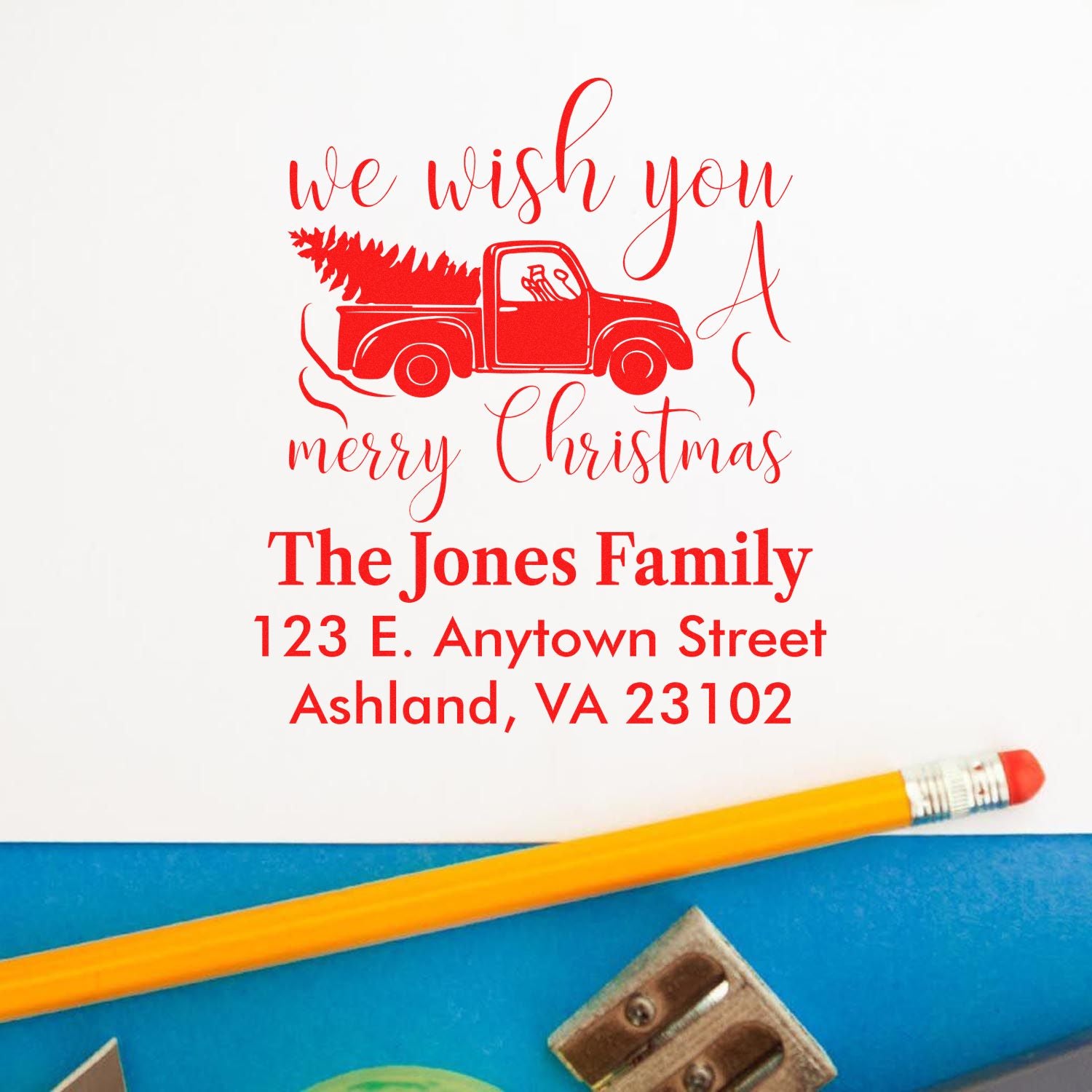 Personalized Christmas rubber stamp with red pickup truck and tree for holiday cards and return address envelopes.