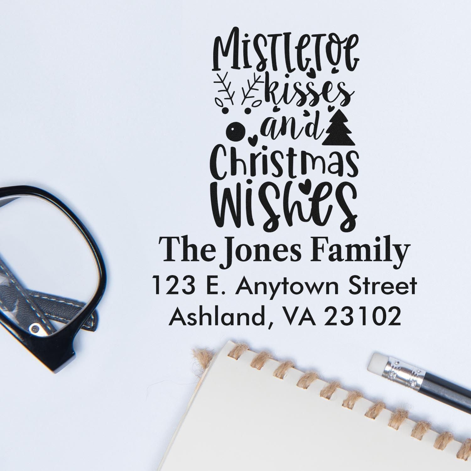 Custom Christmas rubber stamp with Mistletoe kisses and Christmas wishes and personalized family address.