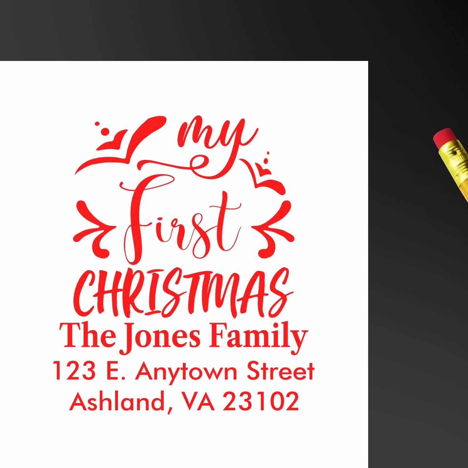 Custom Christmas return address rubber stamp reading My First Christmas with family name and address.