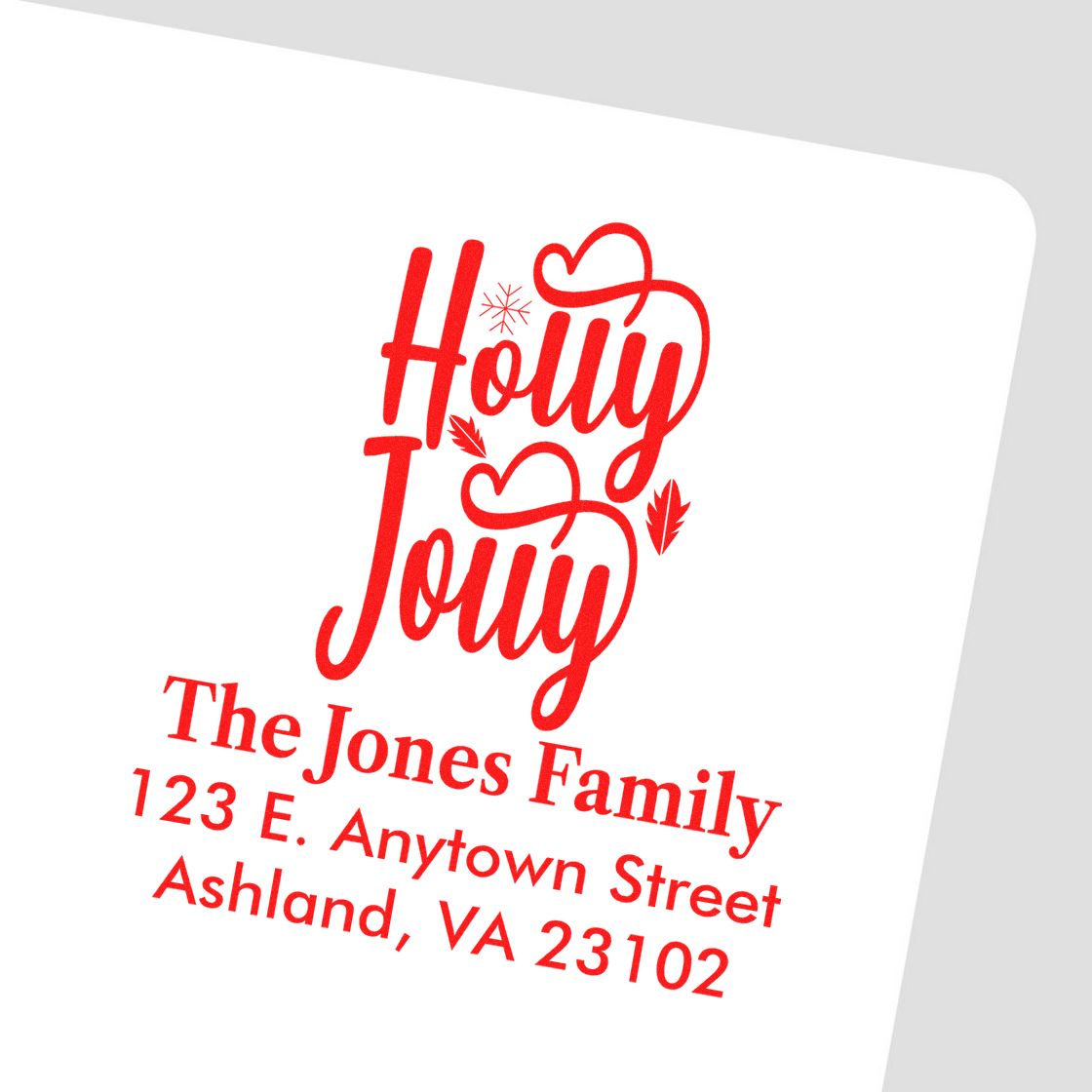 Personalized Holly Jolly holiday return address rubber stamp for The Jones Family with festive Christmas script design.