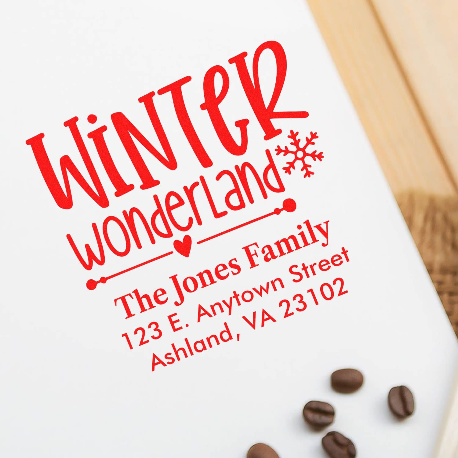 Custom Winter Wonderland rubber stamp with family name and address, a personalized holiday address stamp for cards and mail.