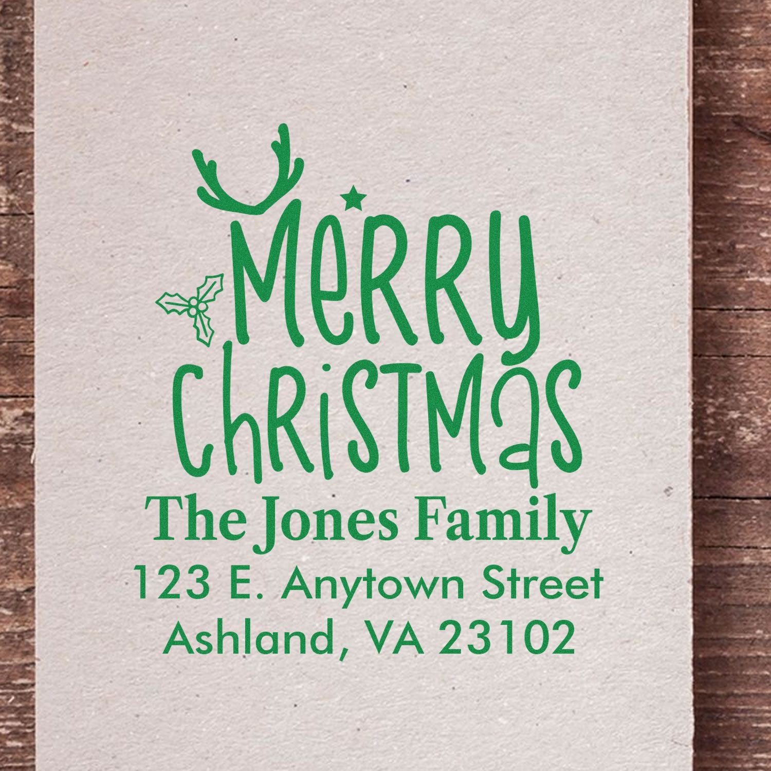 Custom Merry Christmas return address rubber stamp with antler and holly design for The Jones Family.