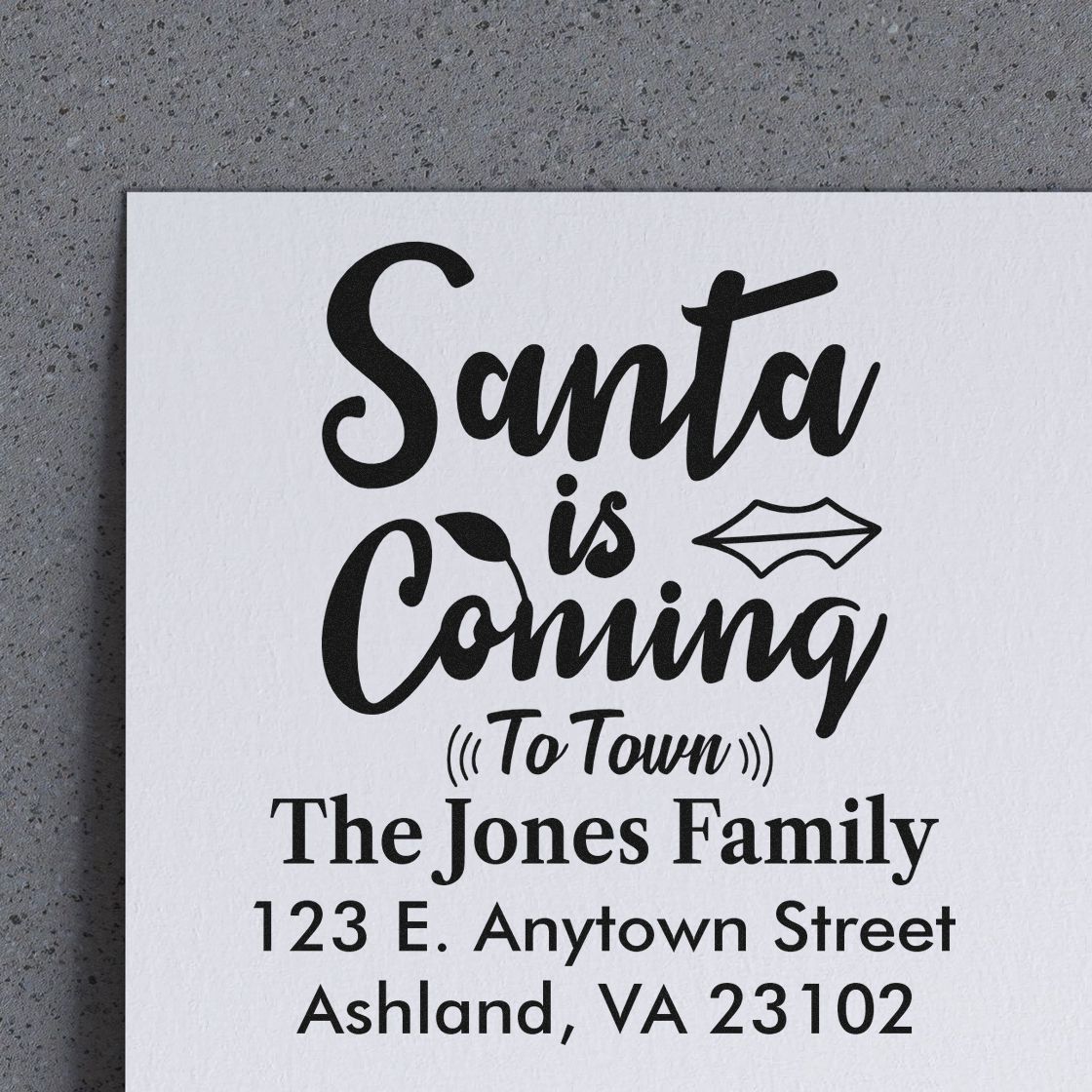Custom Christmas return address rubber stamp featuring Santa is Coming to Town for The Jones Family, Ashland, VA.