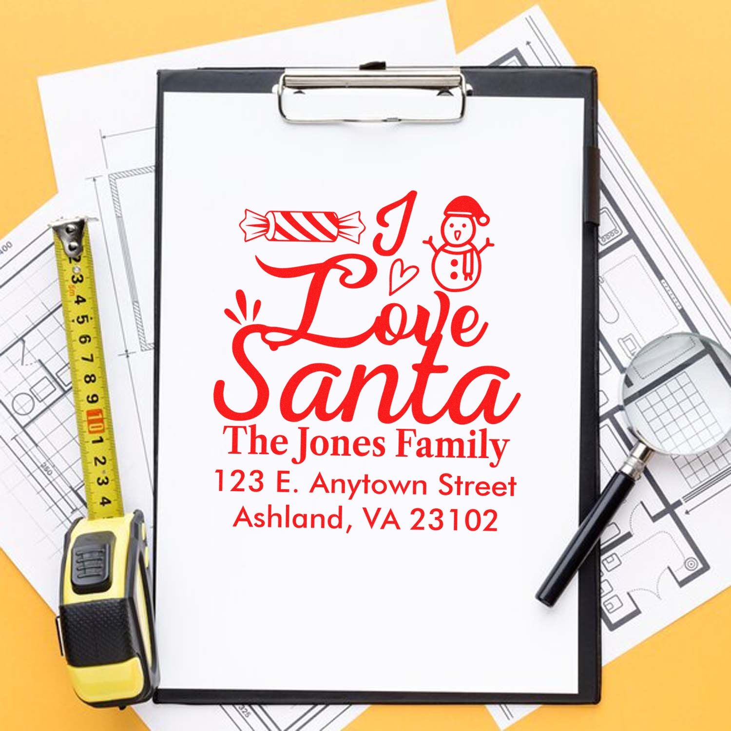 Personalized Santa return address rubber stamp for holiday cards, featuring The Jones Family address and festive Christmas design.