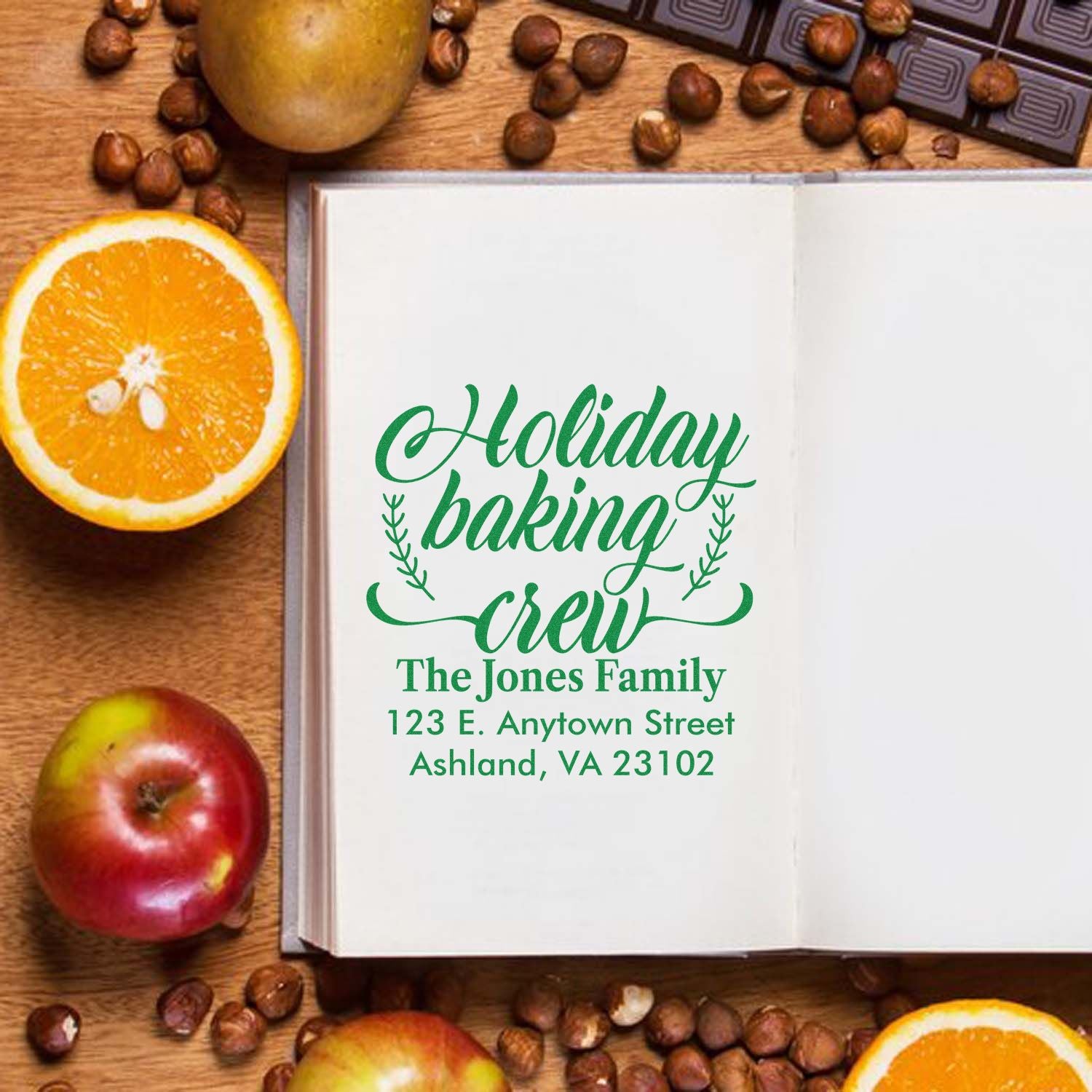 Personalized holiday baking crew rubber stamp with family name and address in festive green script.