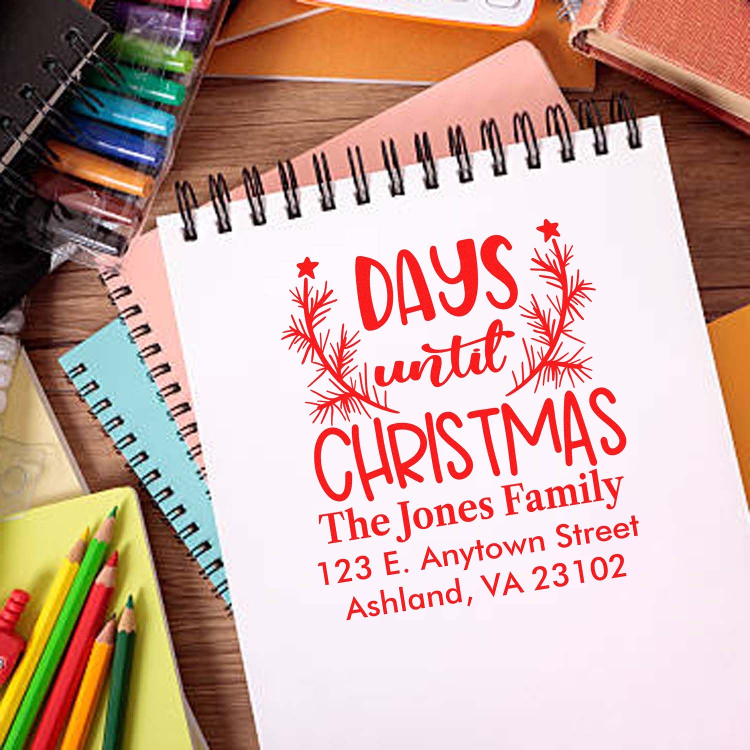 Custom Christmas address rubber stamp with family name, return address, and Days until Christmas countdown.