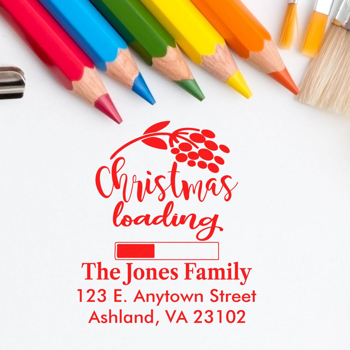 Custom Christmas rubber stamp design with Christmas loading and The Jones Family return address.