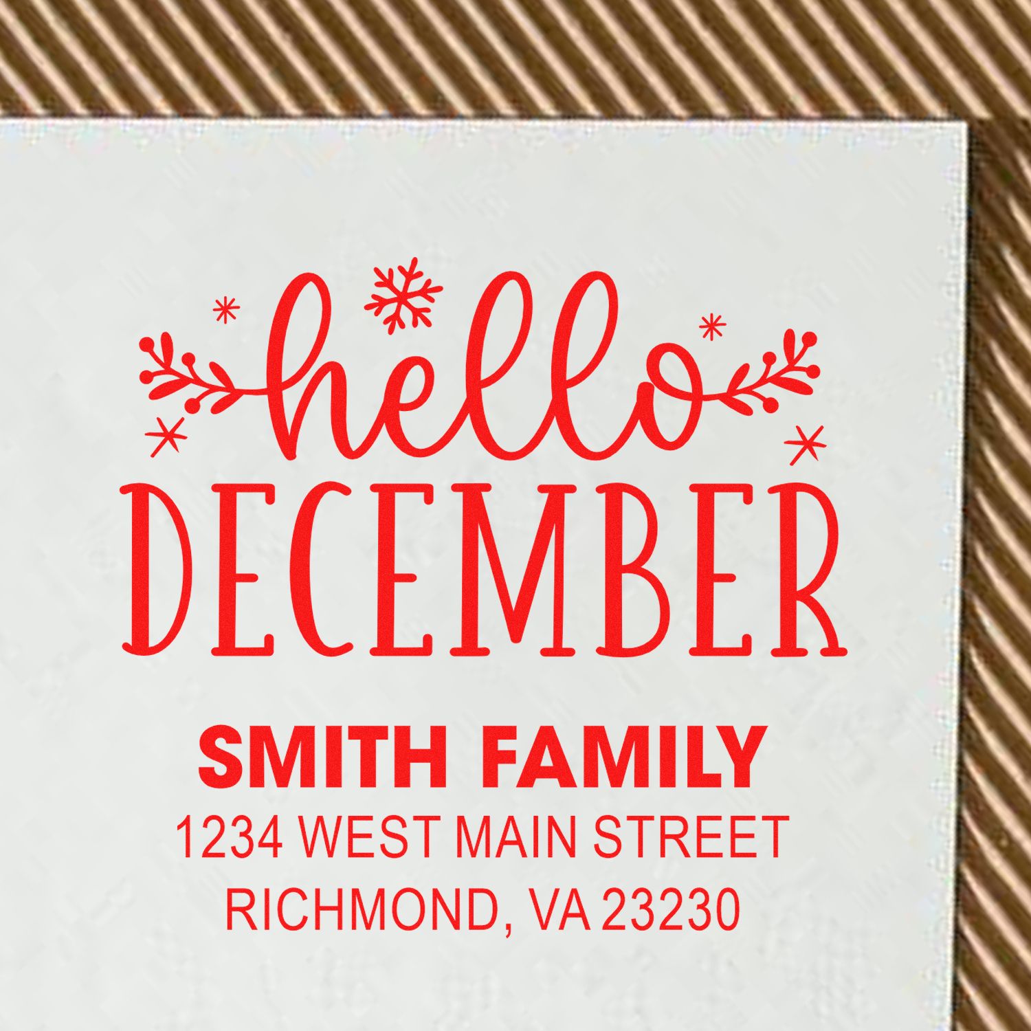 Custom holiday address rubber stamp with hello December, Smith family name, and Richmond, VA address in red.
